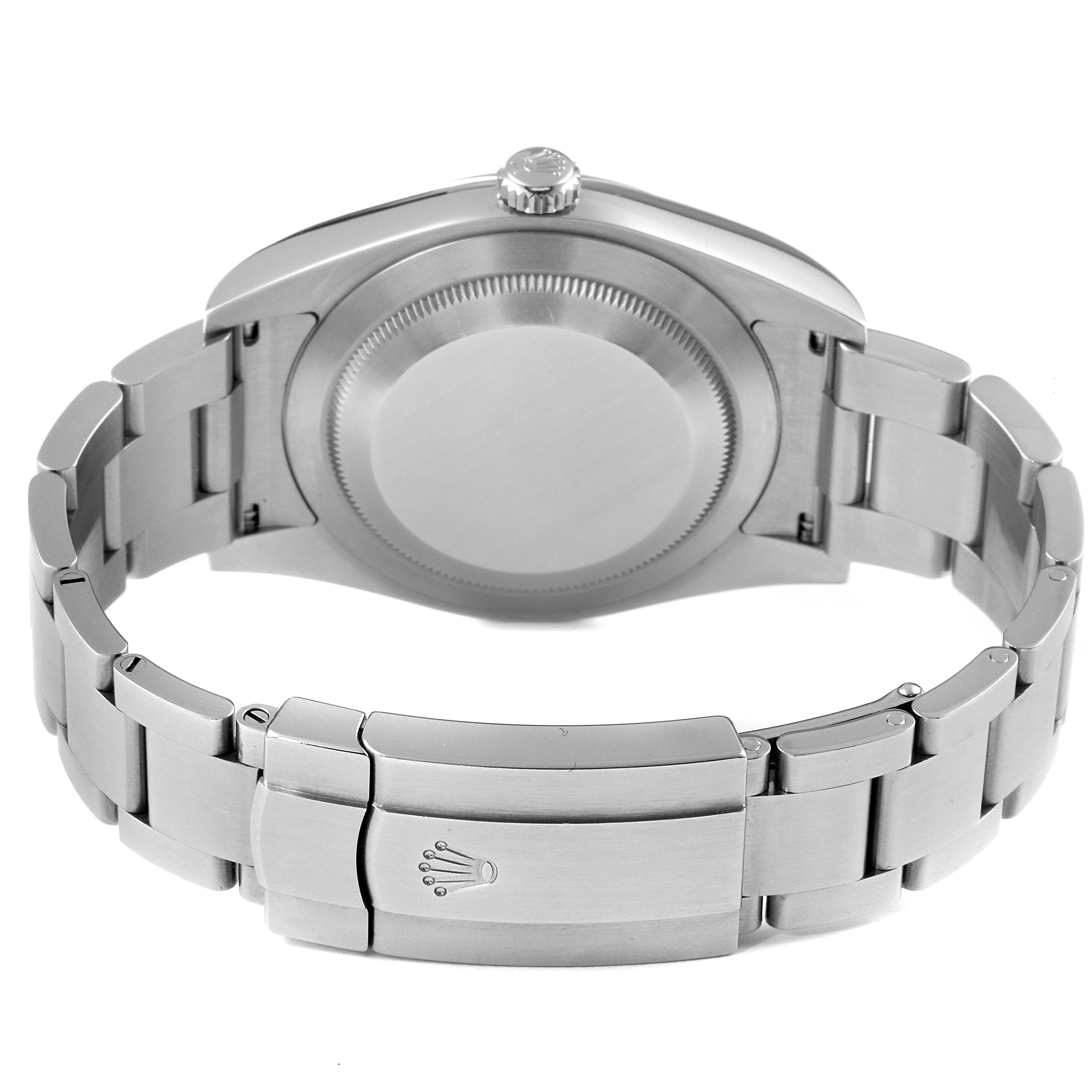 The image shows the back view of a Rolex Oyster Perpetual 114300 Men's Stainless Steel Silver Dial 114300 Men's Stainless Steel Silver Dial watch, focusing on the case and bracelet with the clasp.