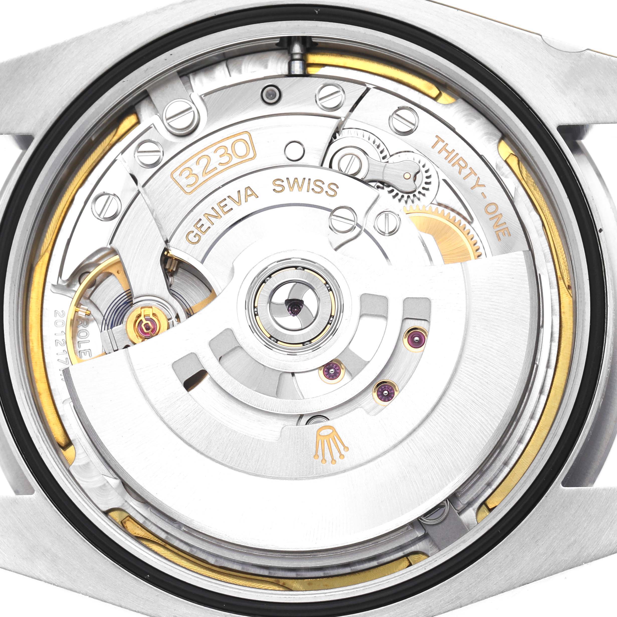 The image shows the movement of a Rolex Oyster Perpetual 124300 Men
s Stainless Steel Blue Dial 124300 Men
s Stainless Steel Blue Dial from a back angle, highlighting its intricate gears and oscillating weight.