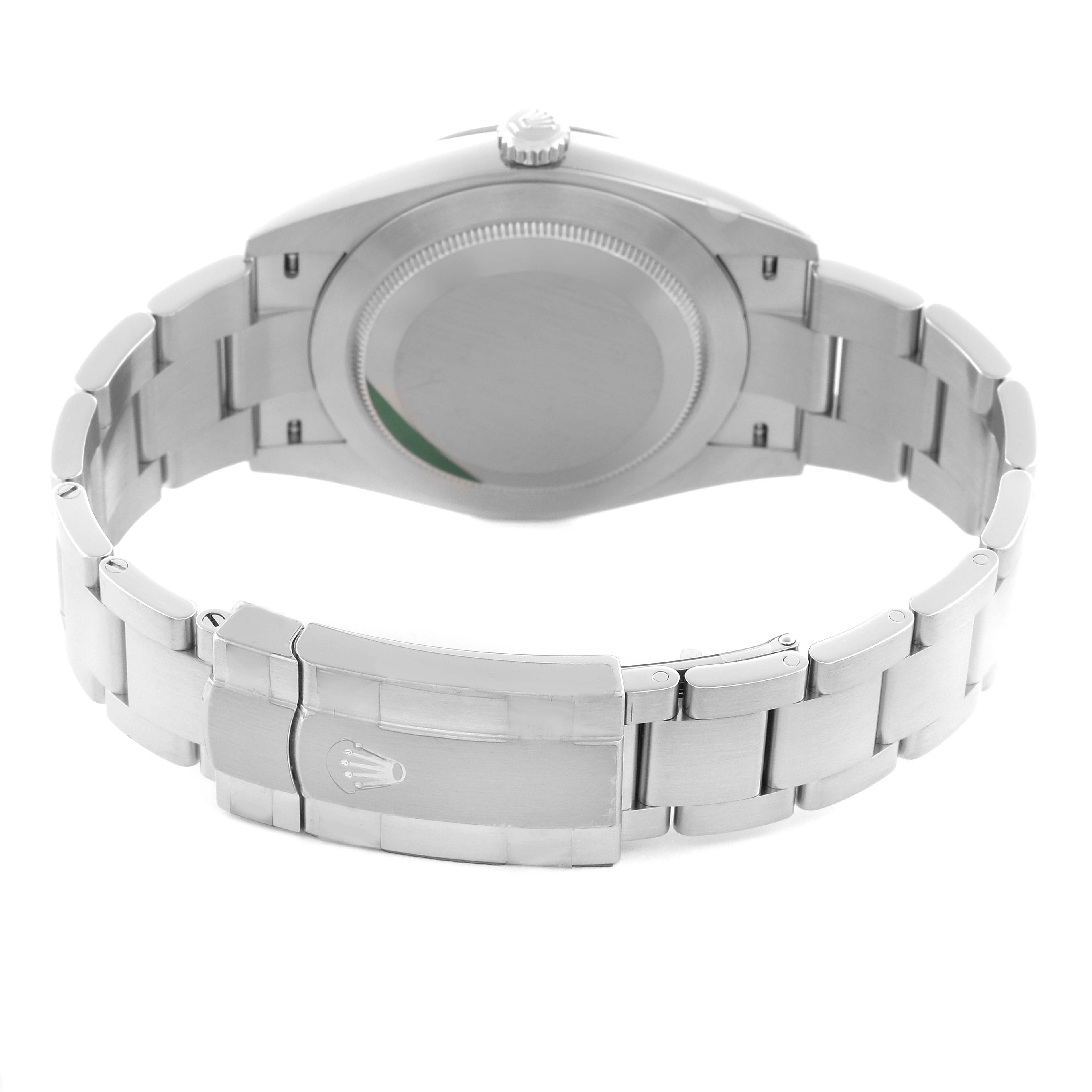 The Rolex Oyster Perpetual 124300 Men
s Stainless Steel Blue Dial 124300 Men
s Stainless Steel Blue Dial watch is shown from the back, highlighting the case back and the stainless steel bracelet with clasp.