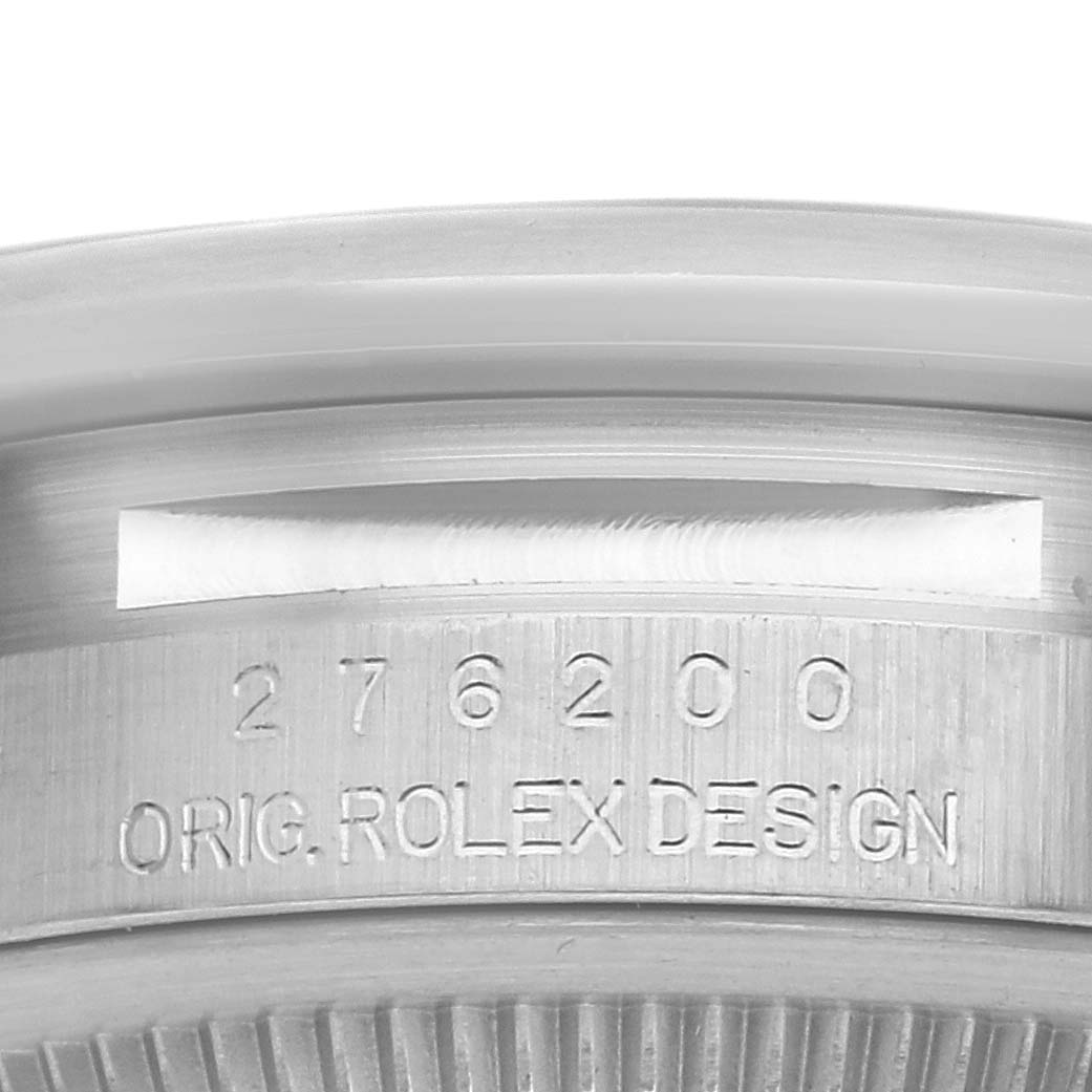 The image shows a close-up of the side of the case for the Rolex Oyster Perpetual 276200 Women
s Stainless Steel Blue Dial 276200 Women
s Stainless Steel Blue Dial, featuring the model number and design engraving.