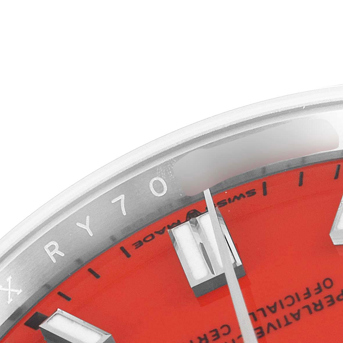 This close-up photo shows a partial view of the dial and bezel of a Rolex Oyster Perpetual 126000 Men's Stainless Steel Red Dial 126000 Men's Stainless Steel Red Dial watch.