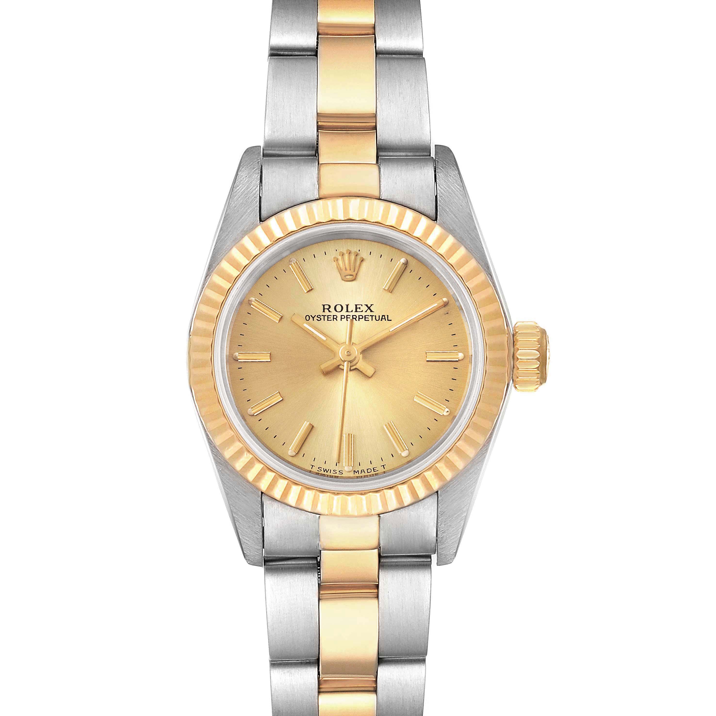 This is a front view of a Rolex Oyster Perpetual 67193 Women
s Steel and Gold (two tone) Champagne Dial 67193 Women
s Steel and Gold (two tone) Champagne Dial watch, showing the gold and silver bracelet, dial, and fluted bezel.