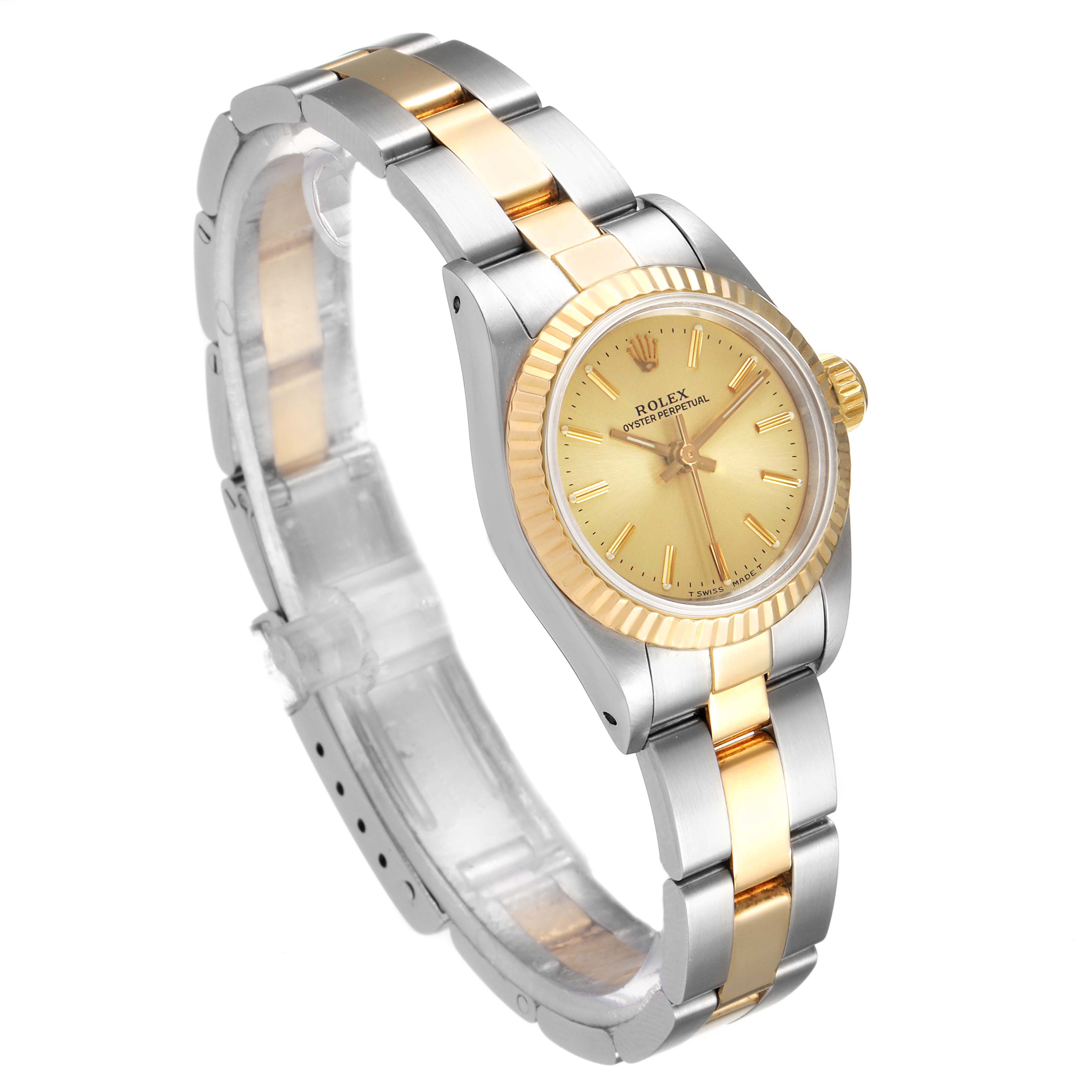 The image shows a side and front angle of the Rolex Oyster Perpetual 67193 Women
s Steel and Gold (two tone) Champagne Dial 67193 Women
s Steel and Gold (two tone) Champagne Dial watch, highlighting its two-tone bracelet and golden dial.