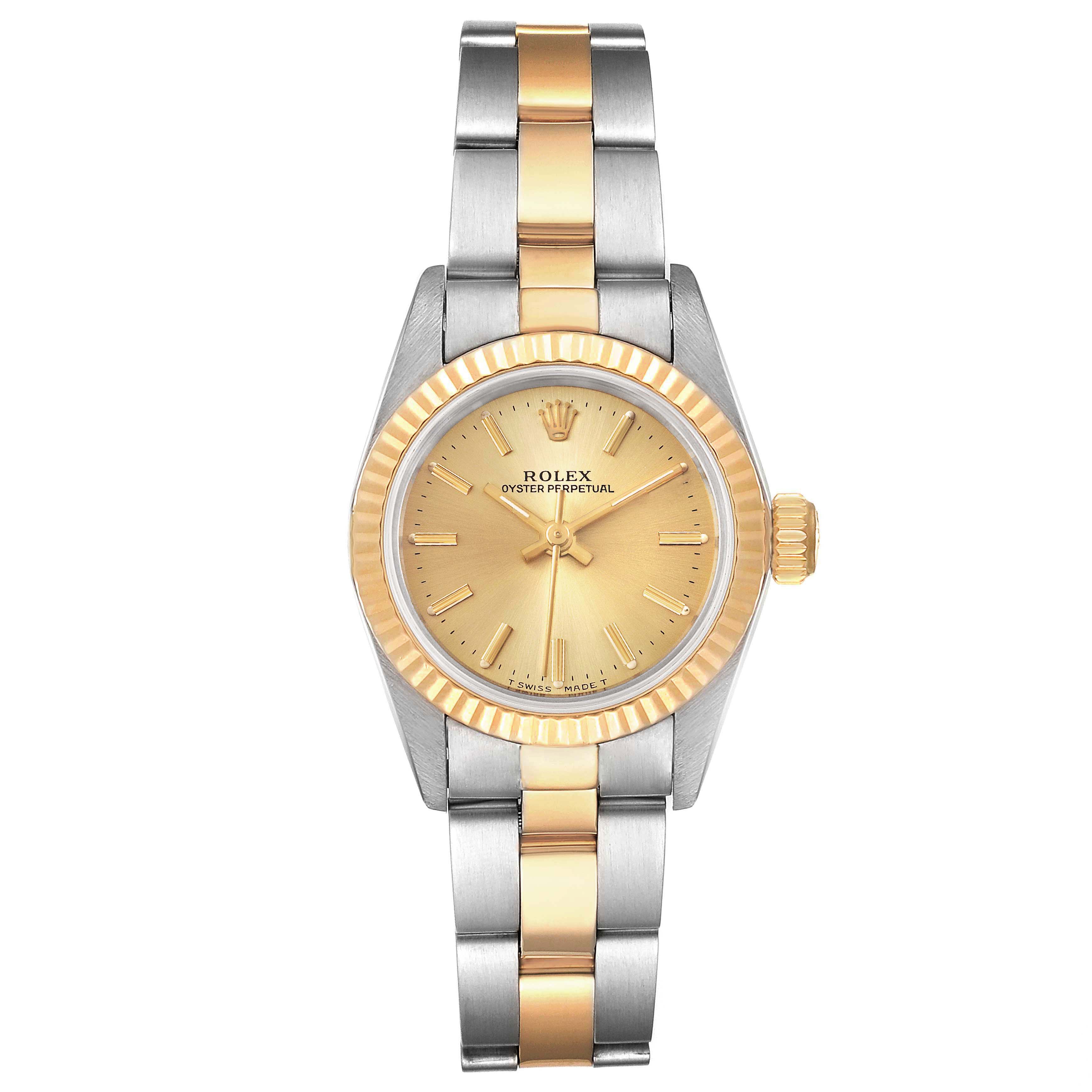 The Rolex Oyster Perpetual 67193 Women
s Steel and Gold (two tone) Champagne Dial 67193 Women
s Steel and Gold (two tone) Champagne Dial watch is shown from a front angle, displaying its face, bezel, crown, and bracelet.