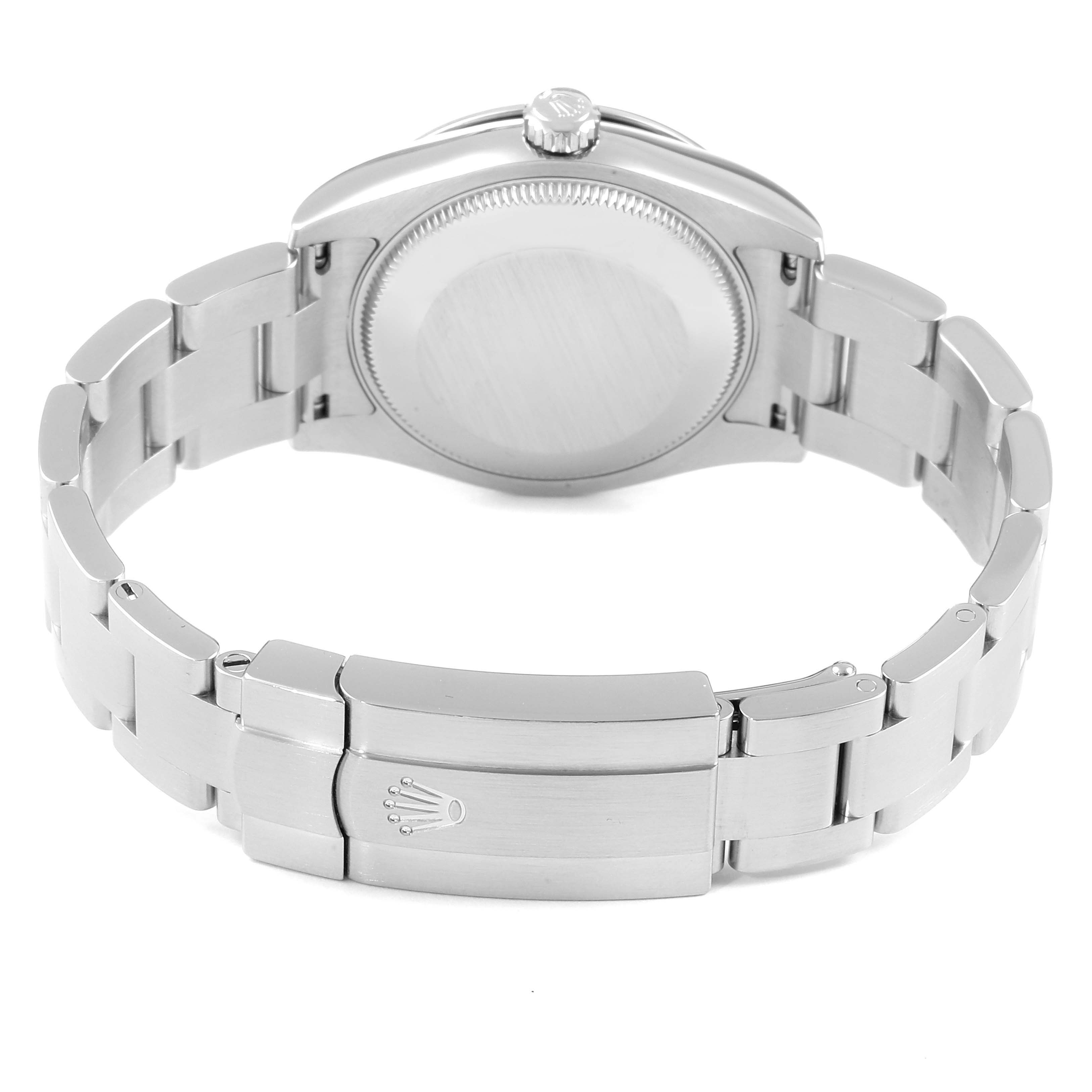 This image shows the back and bracelet of the Mid-Size Rolex watch at an angle showcasing the clasp and case back.