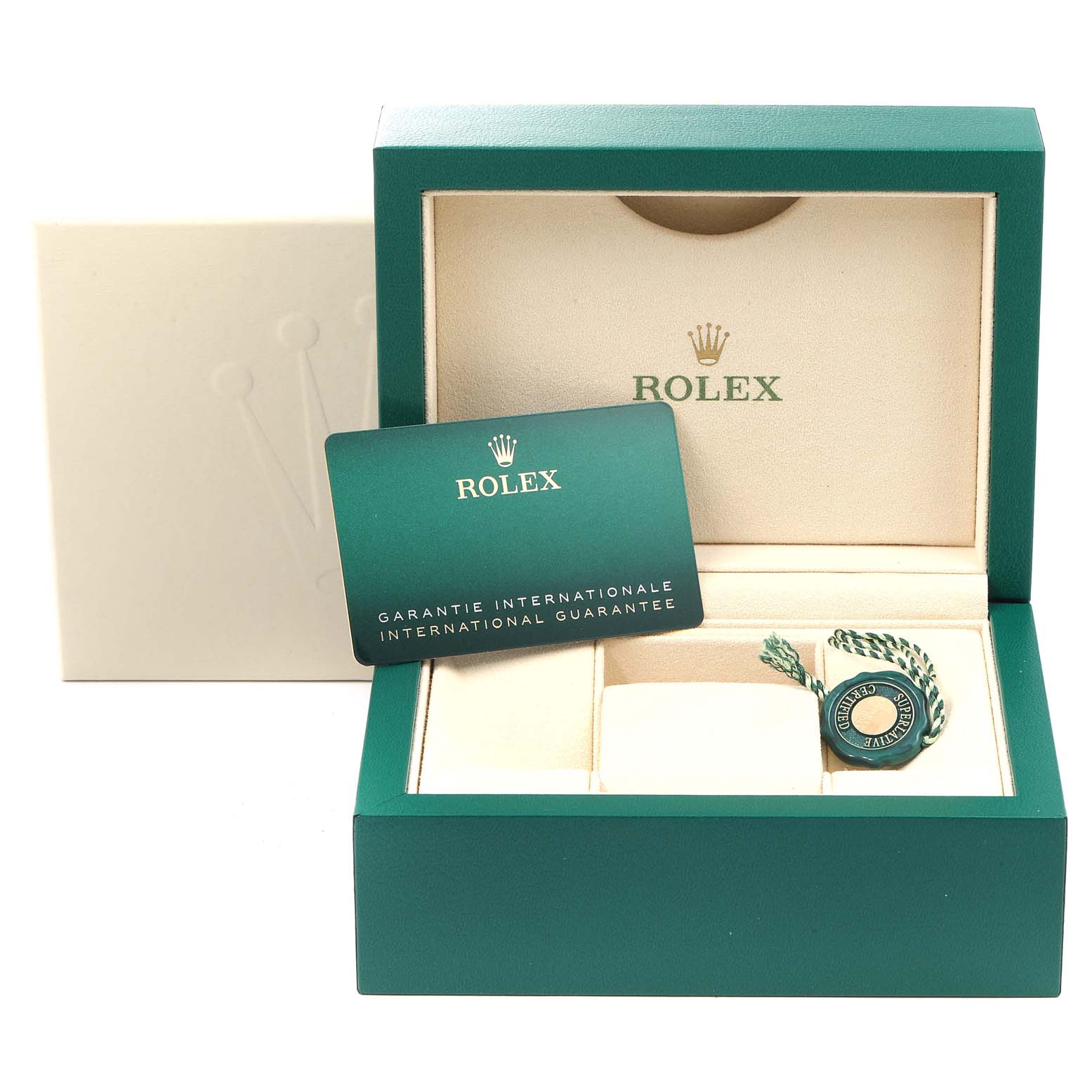 The image shows the open box of a Rolex Mid-Size 177200 Women's Stainless Steel Grey Dial 177200 Women's Stainless Steel Grey Dial watch with an international guarantee card and a green seal inside.