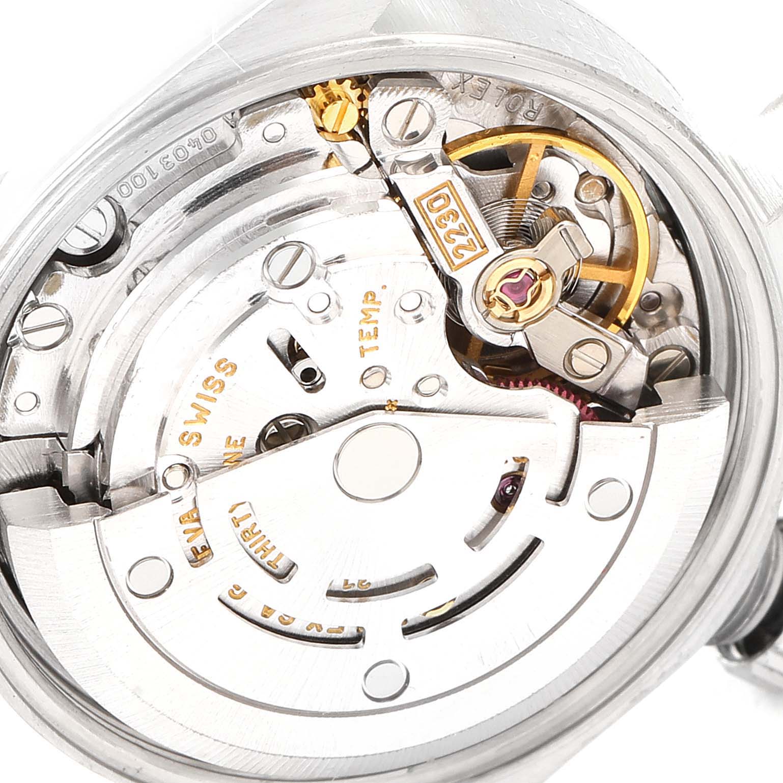 This image shows the intricate movement parts of a Rolex Oyster Perpetual 76080 Women's Stainless Steel Silver Dial 76080 Women's Stainless Steel Silver Dial watch from a close-up, internal angle.