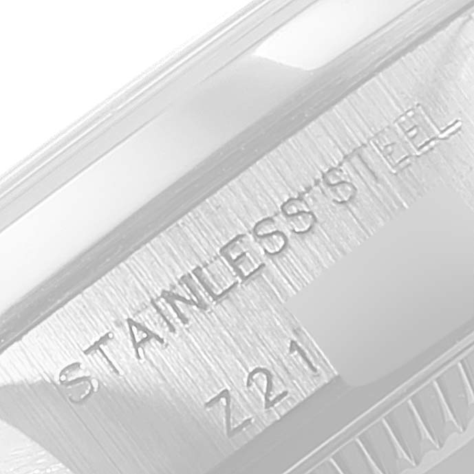 This close-up image shows the "STAINLESS STEEL" engraving on the side of a Rolex Oyster Perpetual 76080 Women
s Stainless Steel Silver Dial 76080 Women
s Stainless Steel Silver Dial watch.