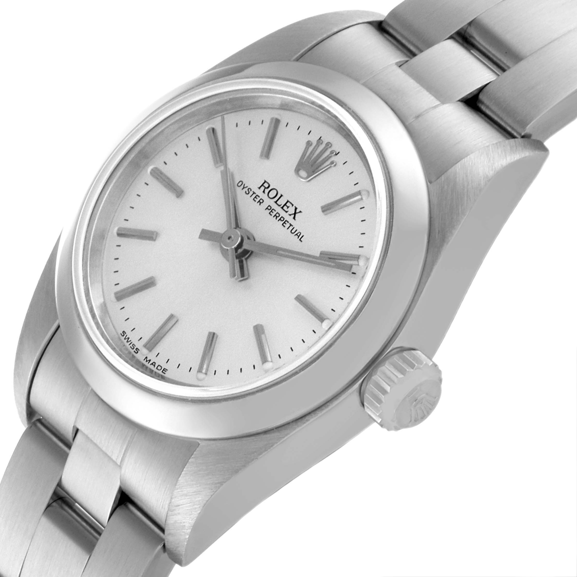 This image shows a side view of a Rolex Oyster Perpetual 76080 Women
s Stainless Steel Silver Dial 76080 Women
s Stainless Steel Silver Dial watch, focusing on the dial, crown, and part of the bracelet.