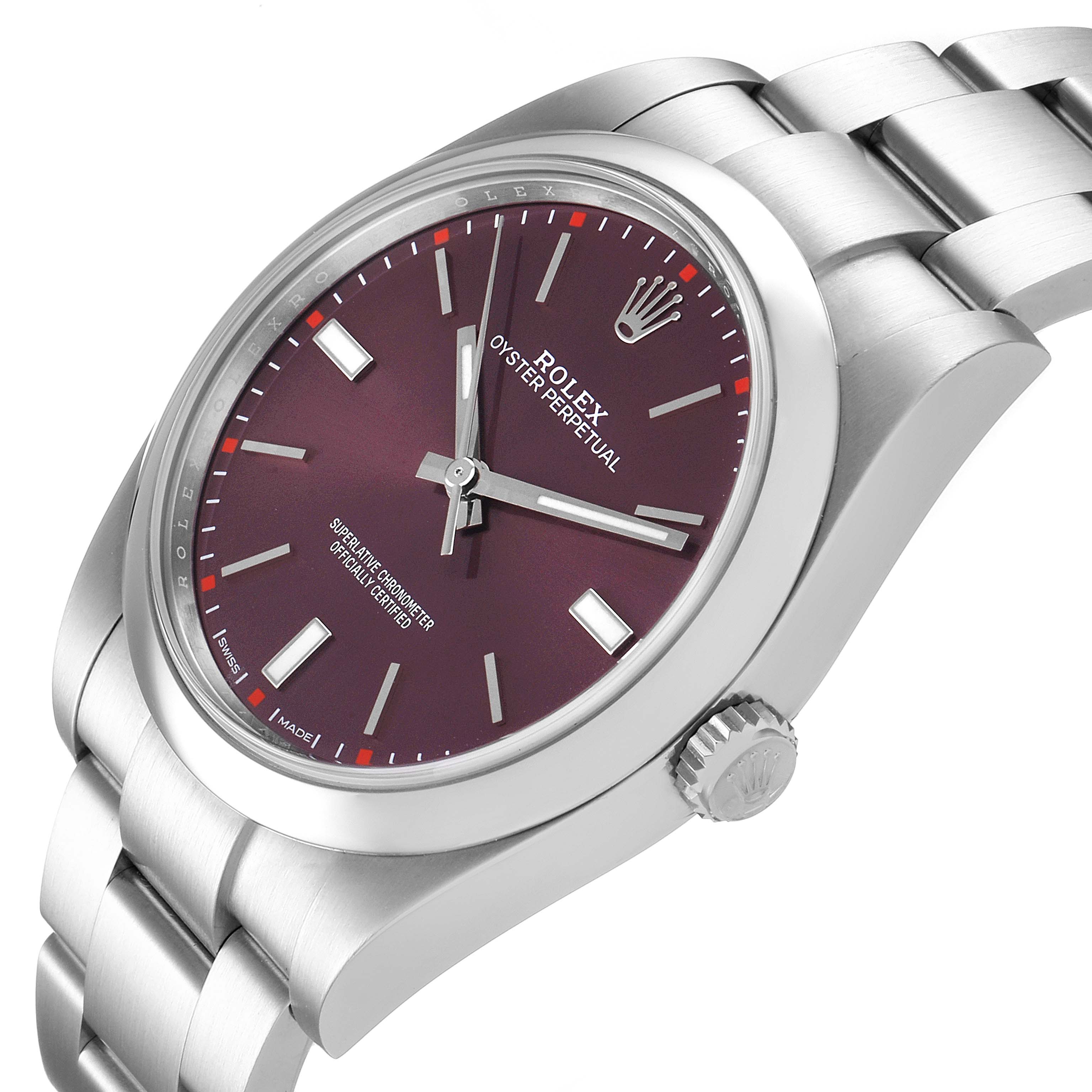 The image shows a Rolex Oyster Perpetual 114300 Men's Stainless Steel Burgundy Dial 114300 Men's Stainless Steel Burgundy Dial watch from a top-side angle, highlighting the dial, crown, and part of the bracelet.