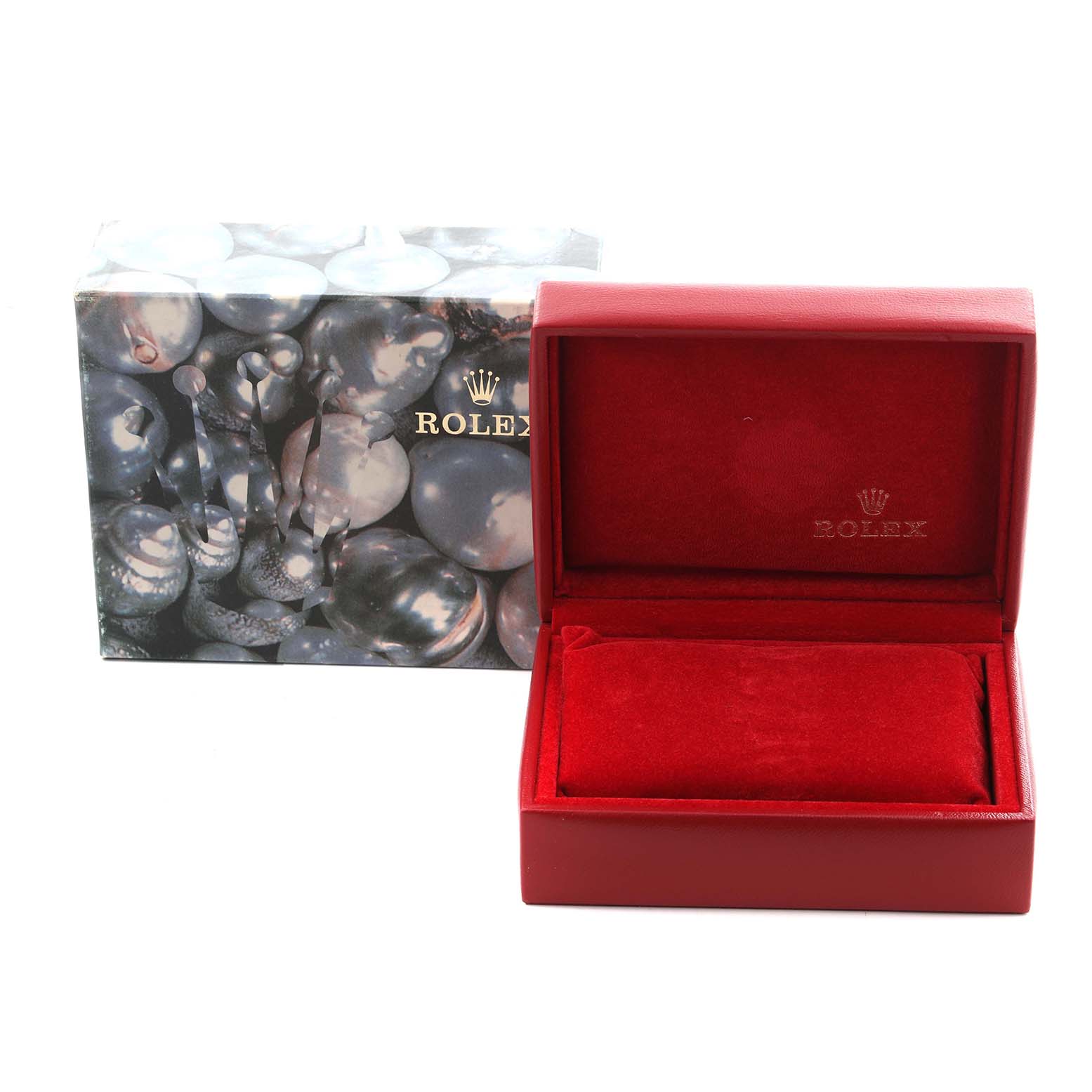The image shows a red Rolex watch box and outer packaging, with no Oyster Perpetual watch visible.