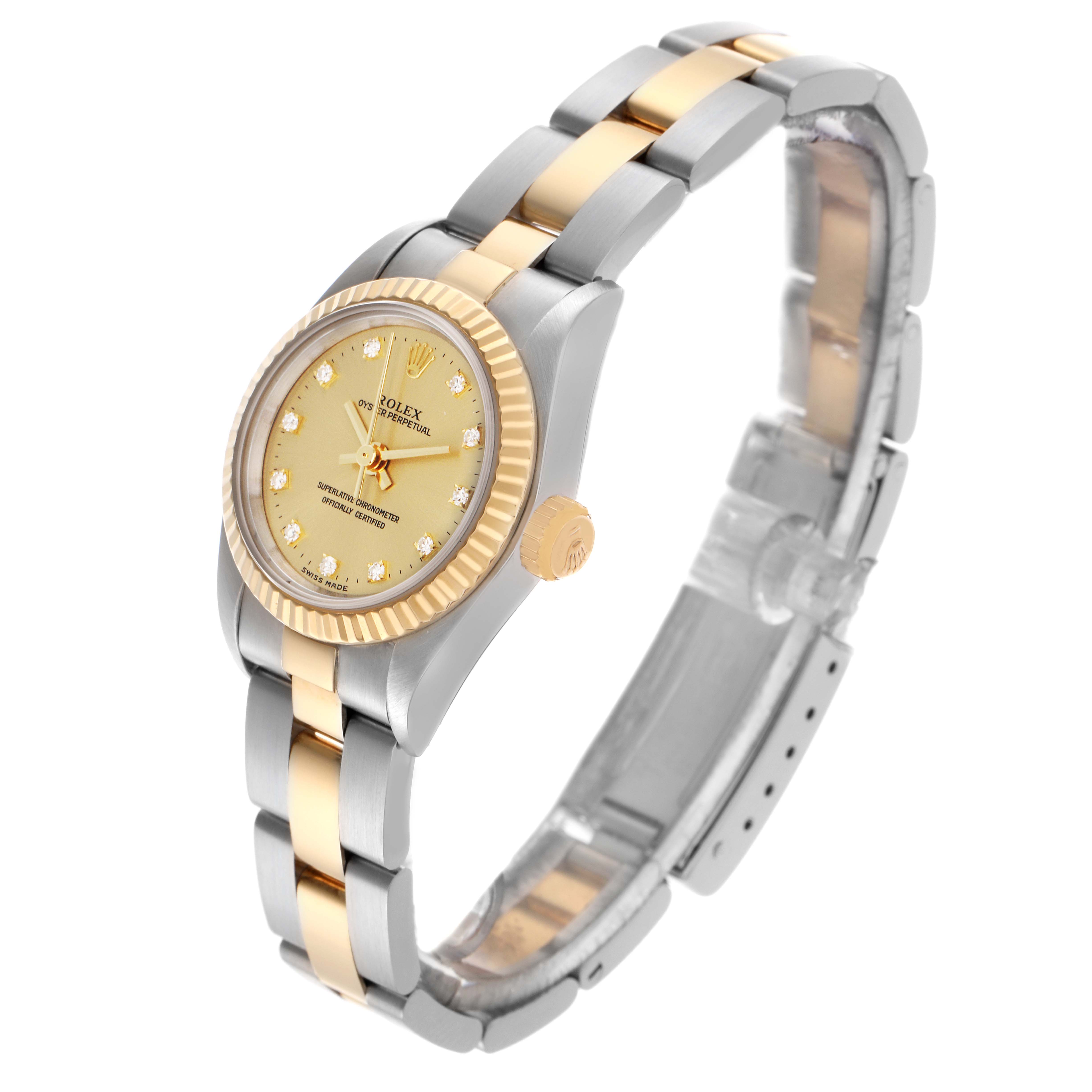 The Rolex Oyster Perpetual 67193 Women's Steel and Gold (two tone) Champagne Dial 67193 Women's Steel and Gold (two tone) Champagne Dial watch is shown at a three-quarter angle, highlighting its bezel, dial, bracelet, and crown.