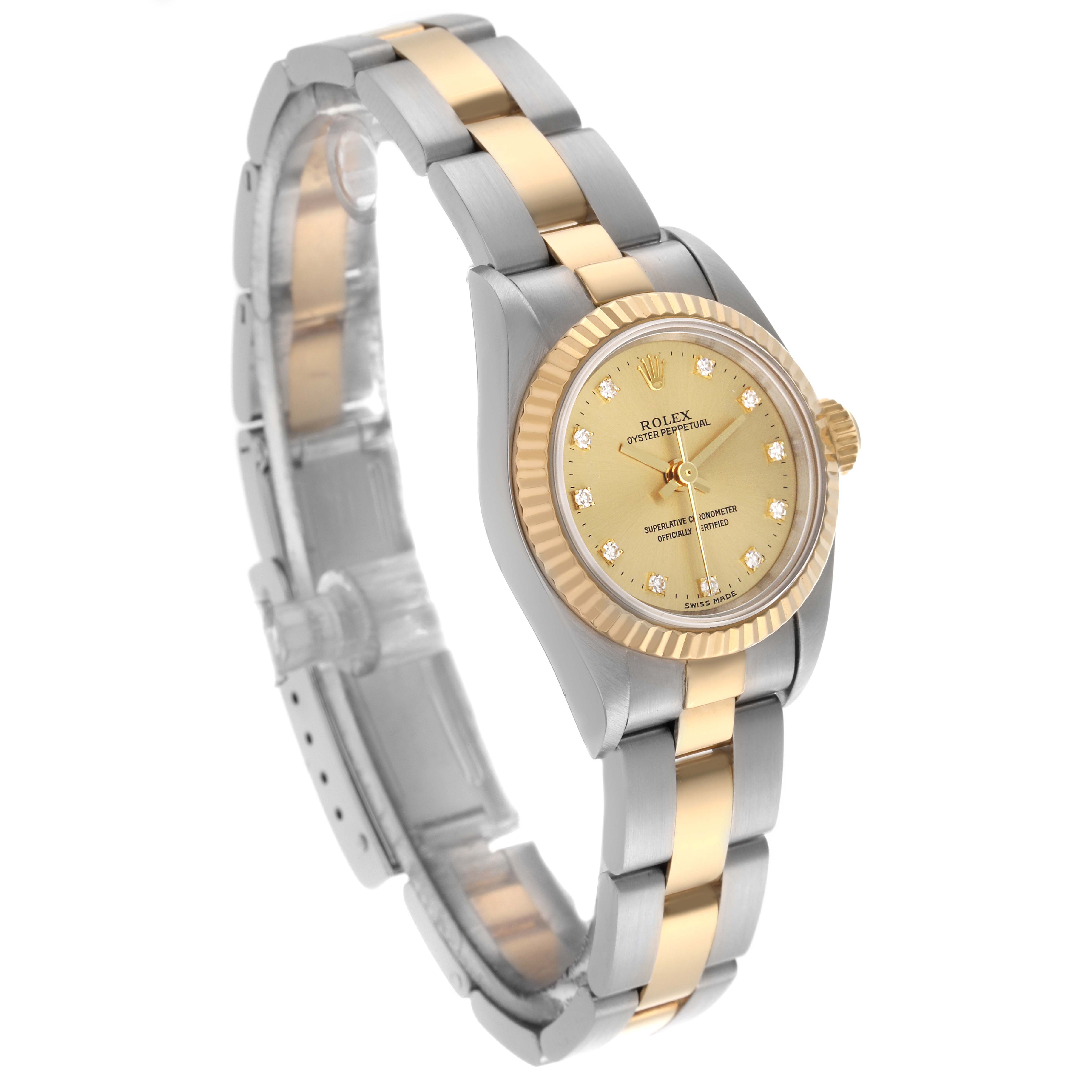 The image shows the Rolex Oyster Perpetual 67193 Women's Steel and Gold (two tone) Champagne Dial 67193 Women's Steel and Gold (two tone) Champagne Dial watch at a slight angle, highlighting its two-tone bracelet and fluted bezel.