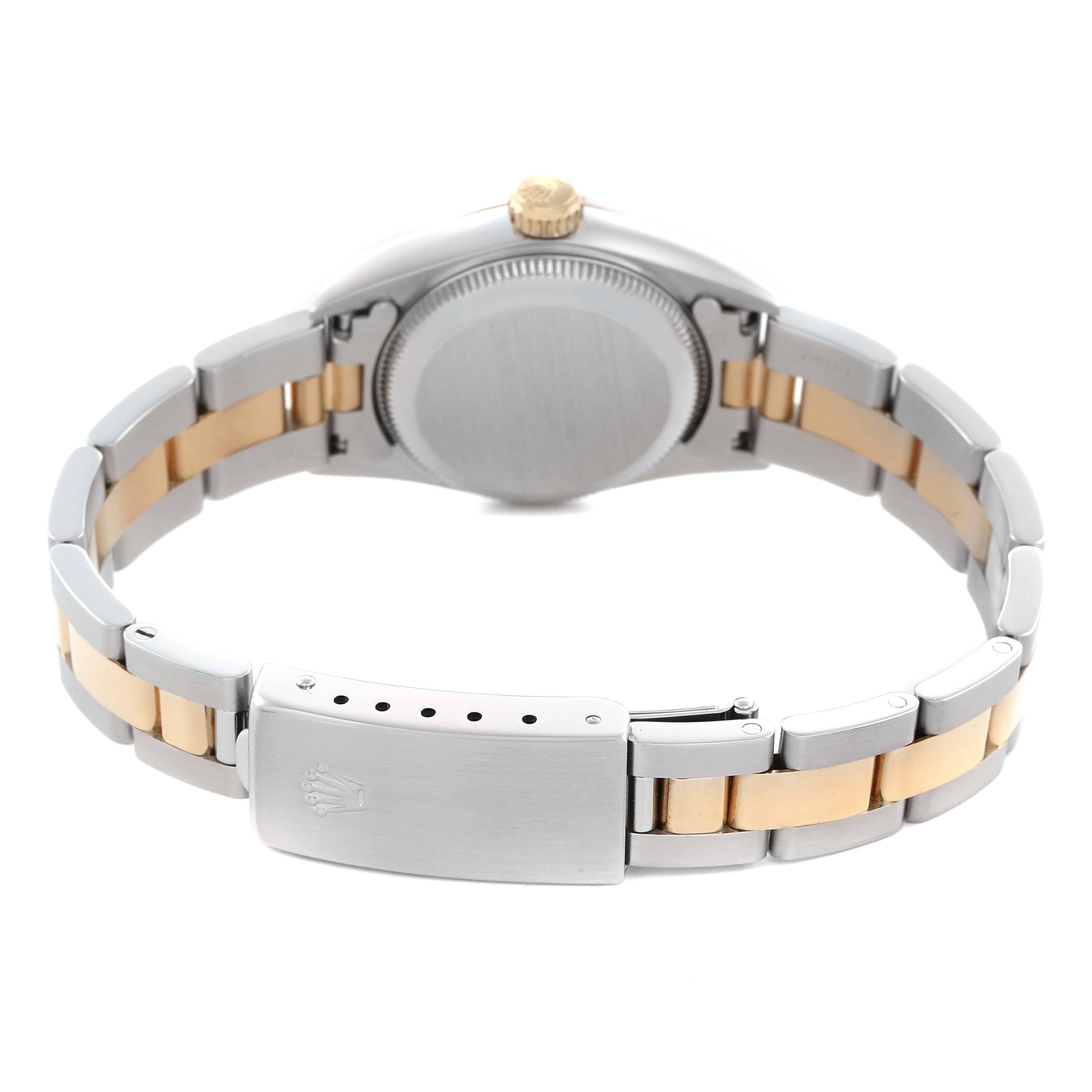 The image shows a rear view of a Rolex Oyster Perpetual 67193 Women's Steel and Gold (two tone) Champagne Dial 67193 Women's Steel and Gold (two tone) Champagne Dial, highlighting its closed clasp and two-tone bracelet.