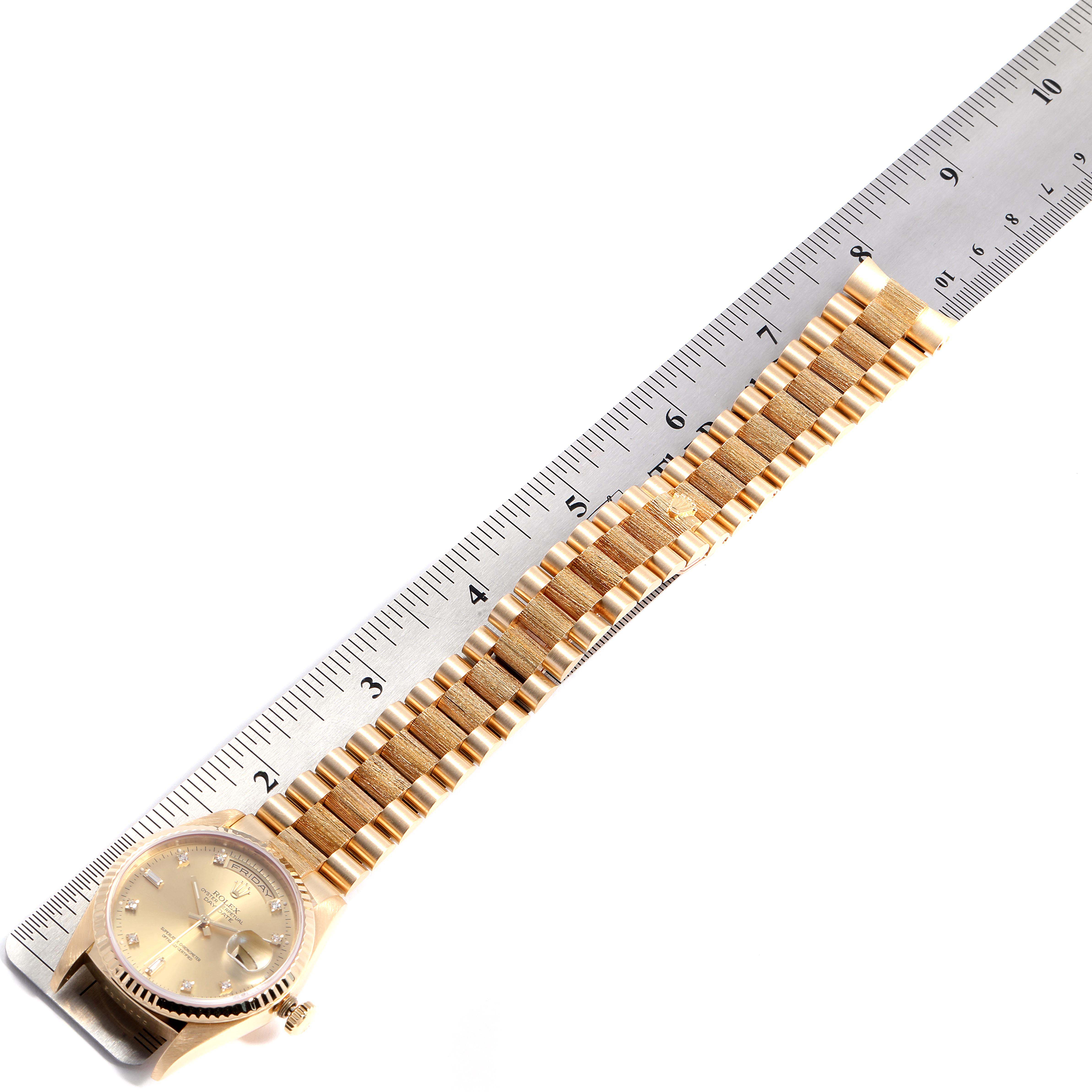 The image shows the Rolex President 18238 Men's Yellow Gold Champagne Dial 18238 Men's Yellow Gold Champagne Dial model watch lying flat, with a ruler measuring its gold bracelet and dial.