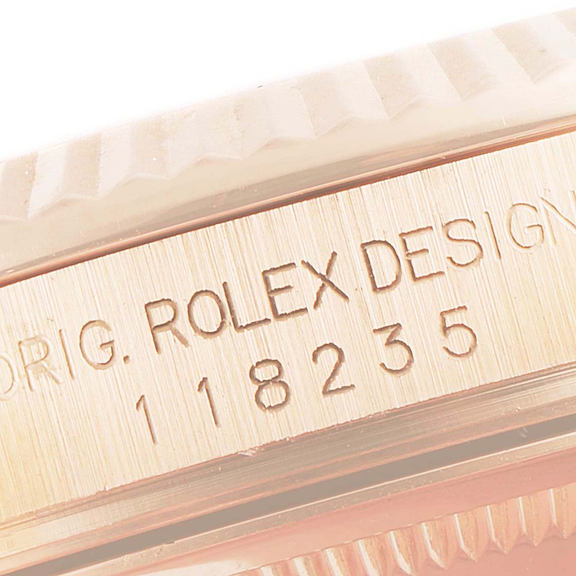 This close-up image shows the edge and model number of a Rolex President 118235 Men's Rose Gold Mother of Pearl Dial 118235 Men's Rose Gold Mother of Pearl Dial watch.