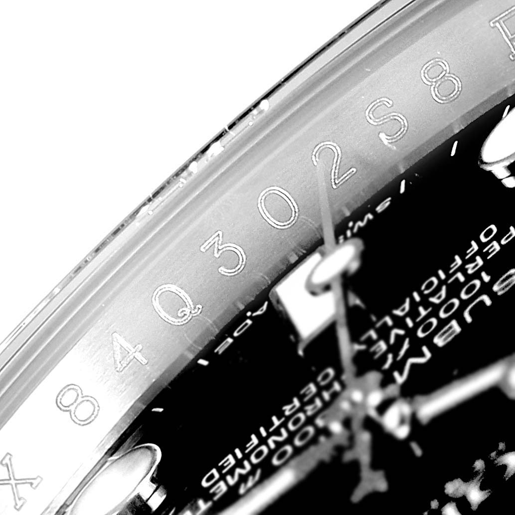 This close-up angle shows the serial number engraving on the inner bezel of a Rolex Submariner 116610 Men
s Stainless Steel Black Dial 116610 Men
s Stainless Steel Black Dial watch.