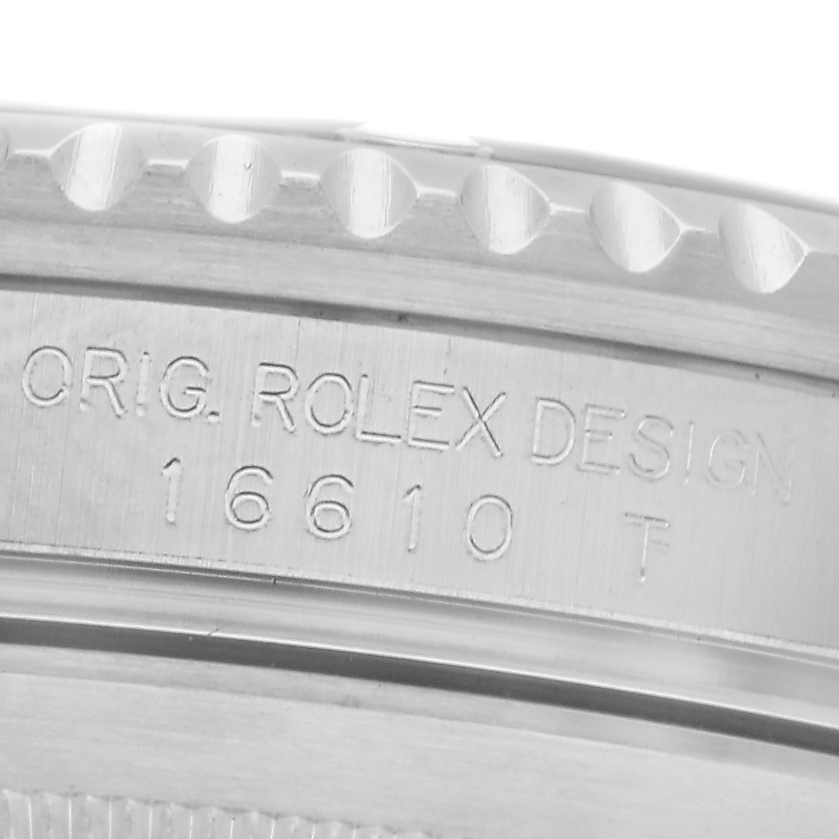 The image shows a close-up of the side of a Rolex Submariner 16610 Men
s Stainless Steel Black Dial 16610 Men
s Stainless Steel Black Dial, highlighting the model number and "ORIG. ROLEX DESIGN" engraving.