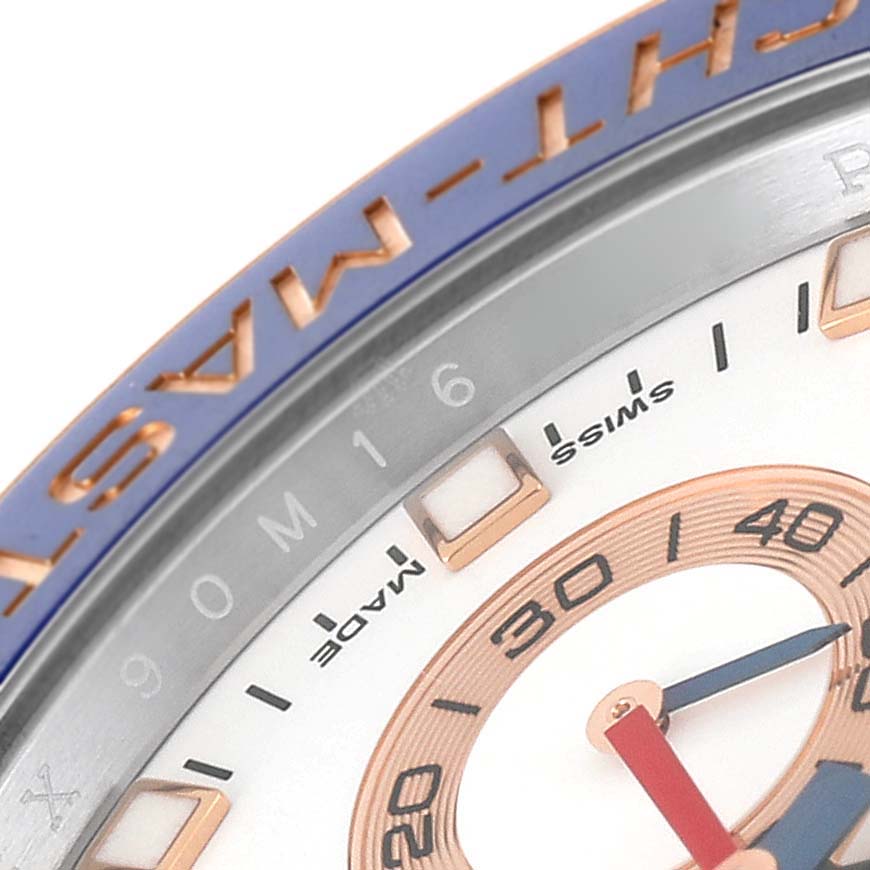 This close-up image shows the bezel, part of the dial, and hour markers of the Rolex Yacht-Master 116681 Men's Steel and Gold (two tone) White Dial 116681 Men's Steel and Gold (two tone) White Dial watch.