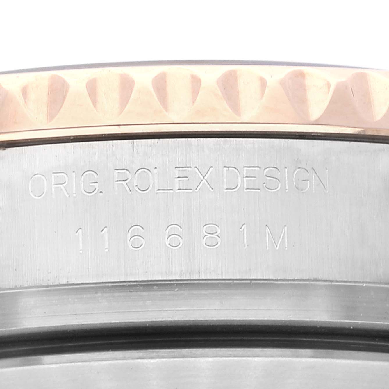 This close-up image shows the engraved reference number and text on the side of the Rolex Yacht-Master 116681 Men's Steel and Gold (two tone) White Dial 116681 Men's Steel and Gold (two tone) White Dial watch case.