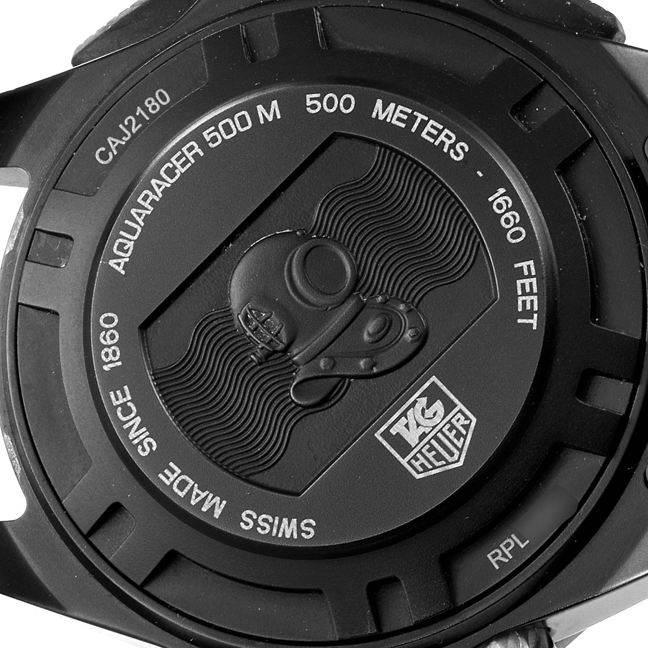 This image shows the back case of a Tag Heuer Aquaracer CAJ2180.FT6023 Men's Titanium Black Dial CAJ2180.FT6023 Men's Titanium Black Dial watch, highlighting the model number, water resistance, and logo.