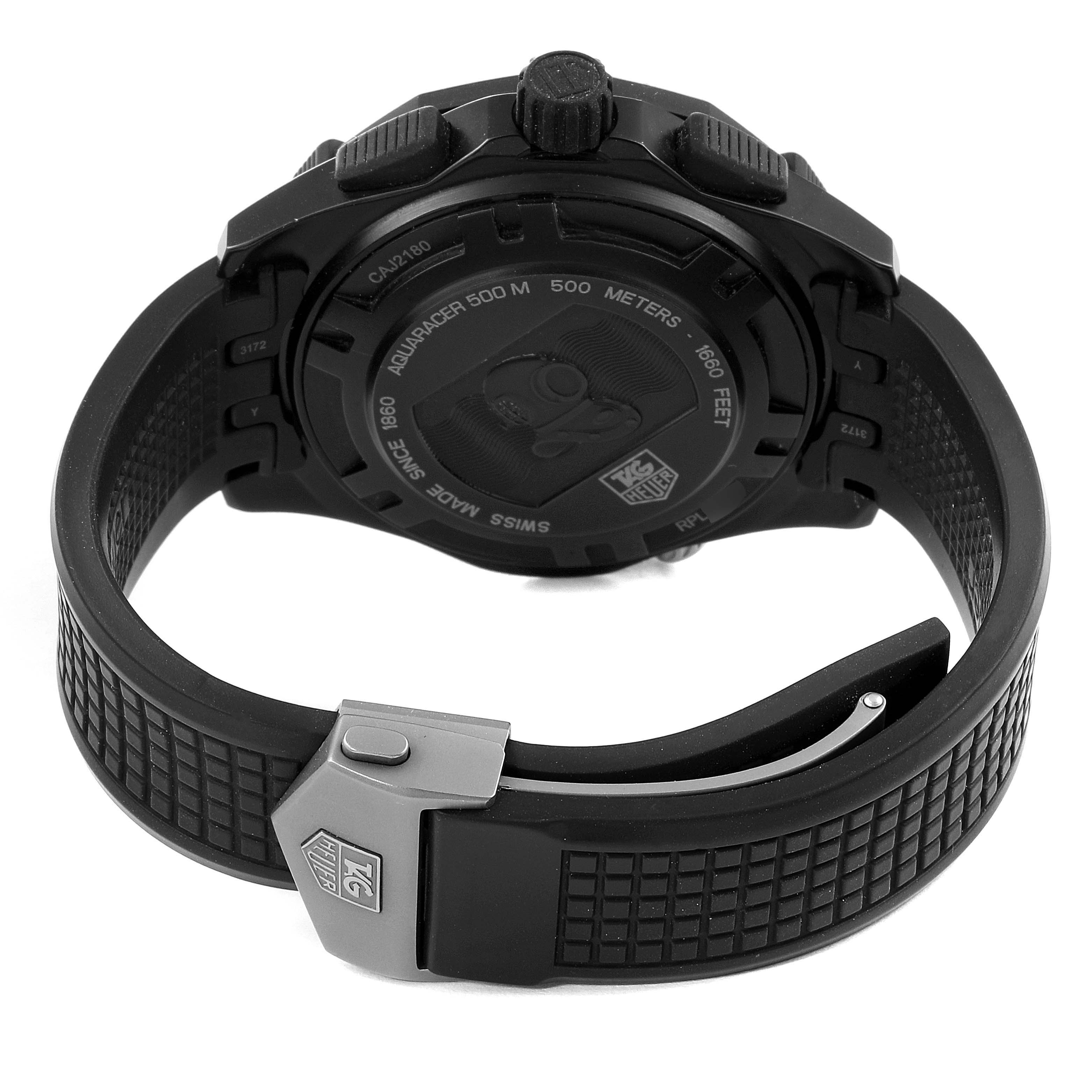 The image shows the back view of a Tag Heuer Aquaracer CAJ2180.FT6023 Men's Titanium Black Dial CAJ2180.FT6023 Men's Titanium Black Dial watch, highlighting the case back and rubber strap with clasp.
