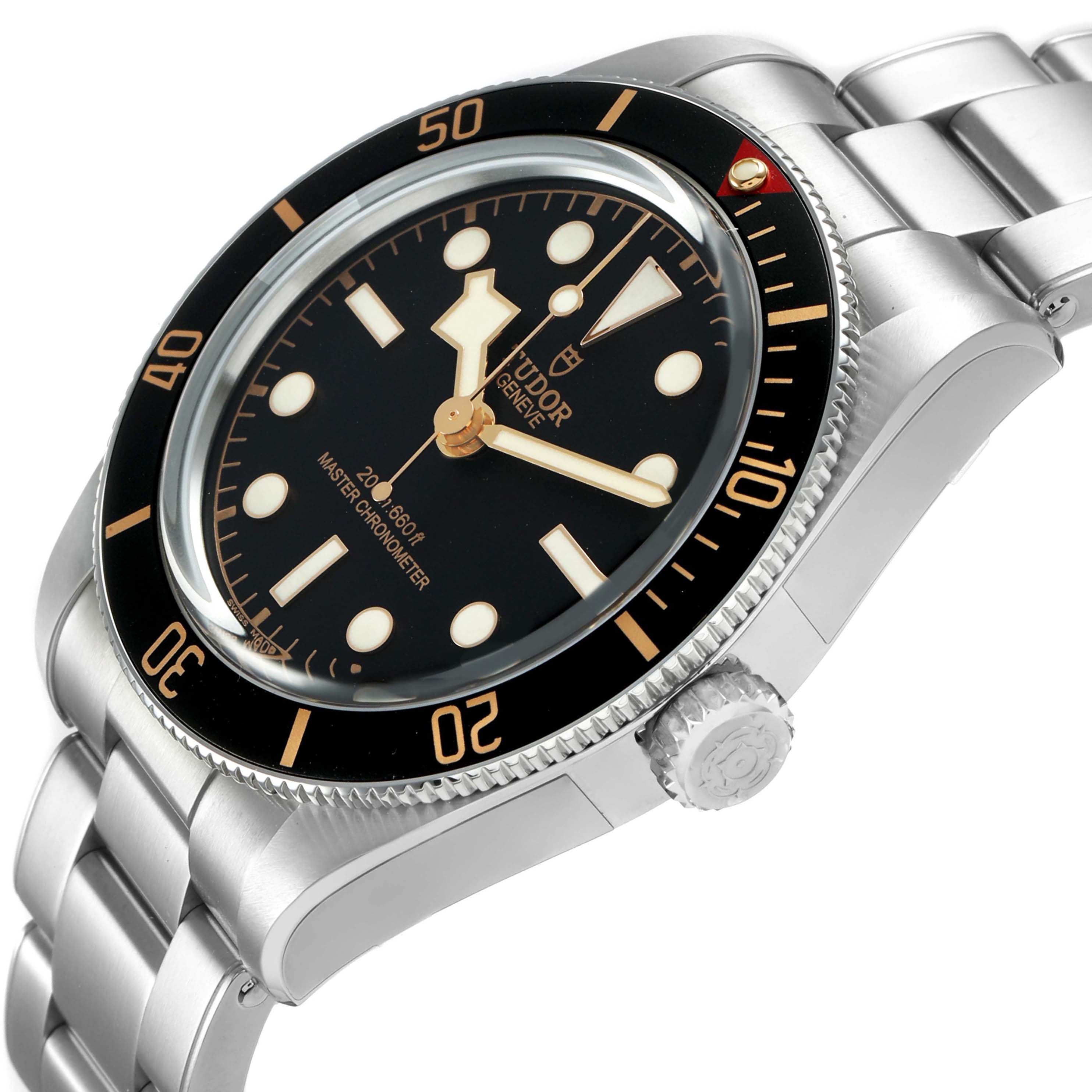 The Tudor Heritage Black Bay 7939A1A0NU Men's Stainless Steel Black Dial watch is shown at a side angle featuring the face, bezel, crown, and bracelet.