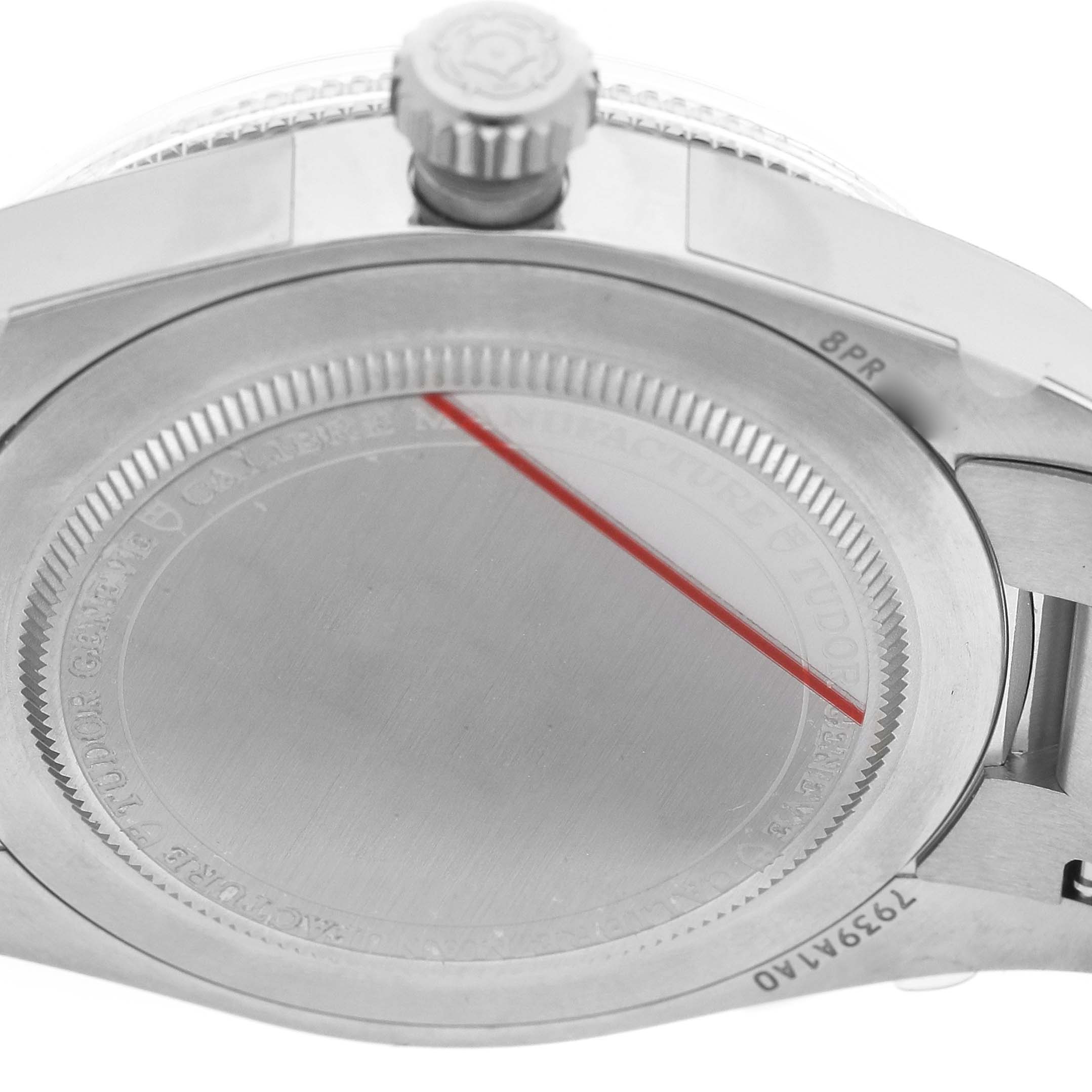 The image shows the back case and crown of a Tudor Heritage Black Bay 7939A1A0NU Men's Stainless Steel Black Dial watch viewed from a side angle.