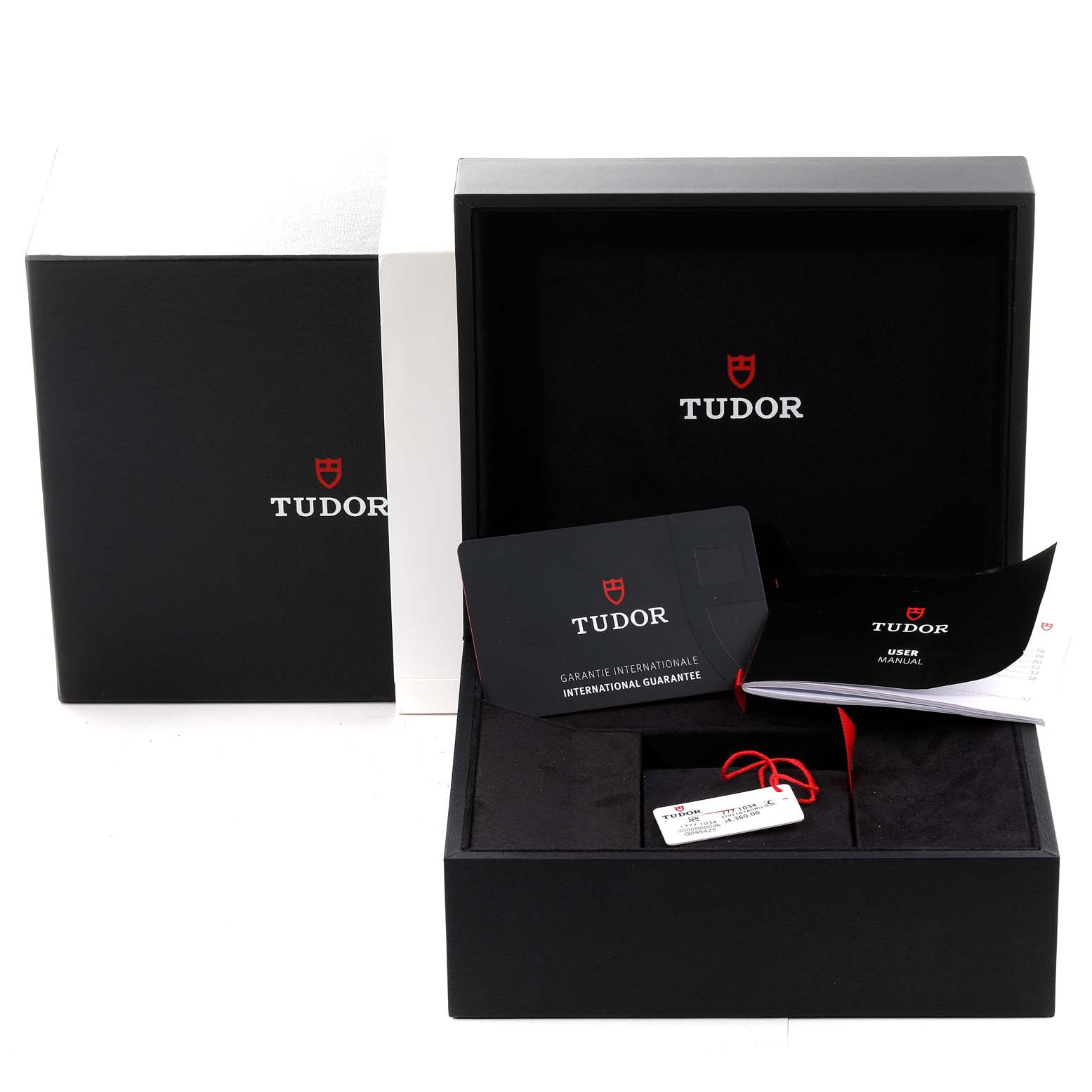 The image shows the packaging, international guarantee card, user manual, and tags for the Tudor Heritage Black Bay M7941A1A0RU-0001 Men
s Stainless Steel Black Dial M7941A1A0RU-0001 Men
s Stainless Steel Black Dial watch model.