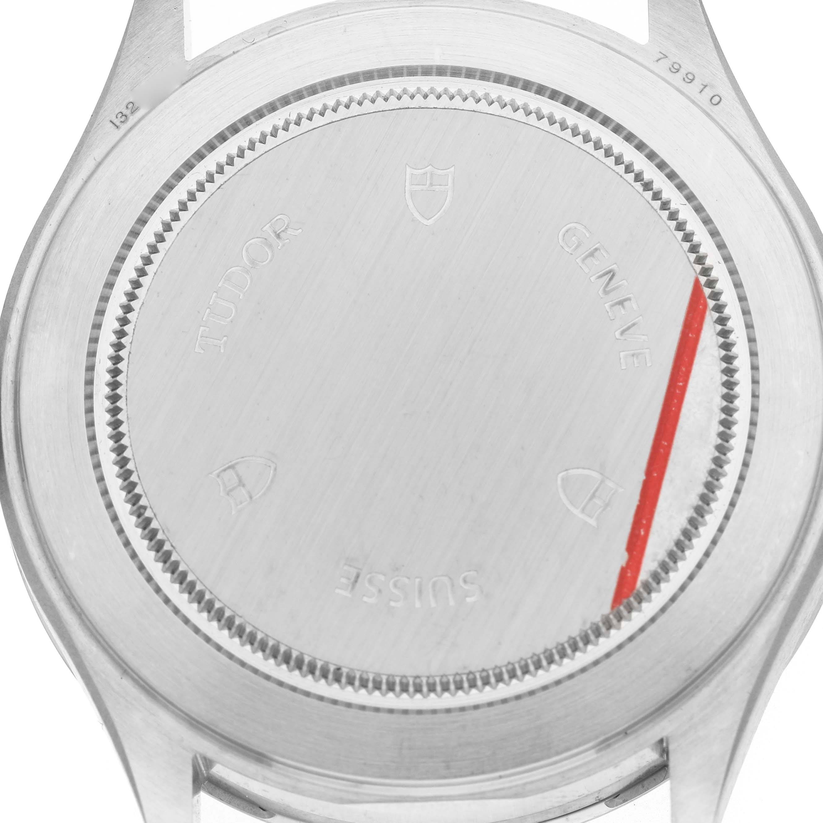 The image shows the case back of a Tudor Heritage Ranger M79910-0002 Men's Stainless Steel Black Dial watch from a top-down angle.