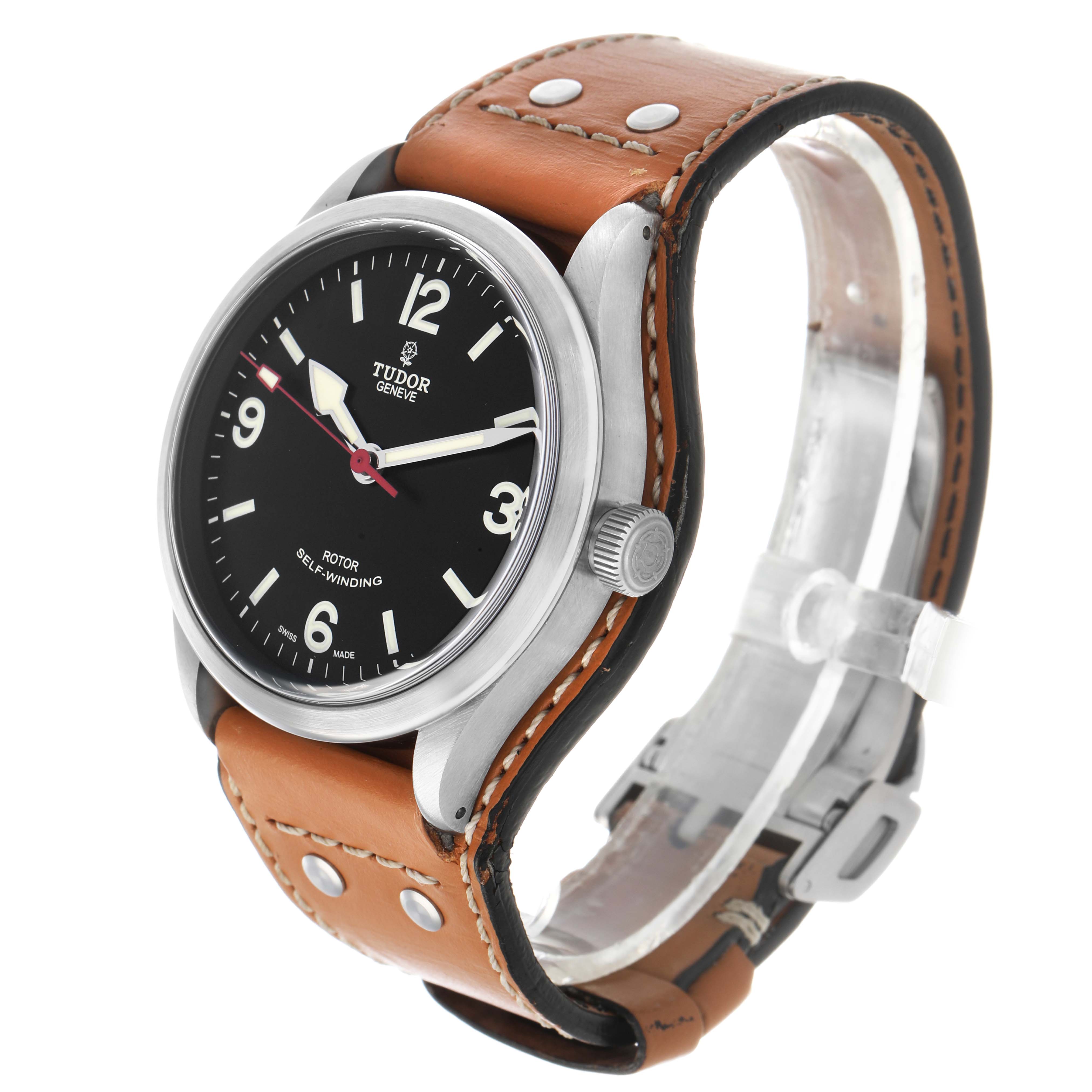 The Tudor Heritage Ranger M79910-0002 Men's Stainless Steel Black Dial watch is shown at a three-quarter angle, displaying the face, case, crown, and leather strap.