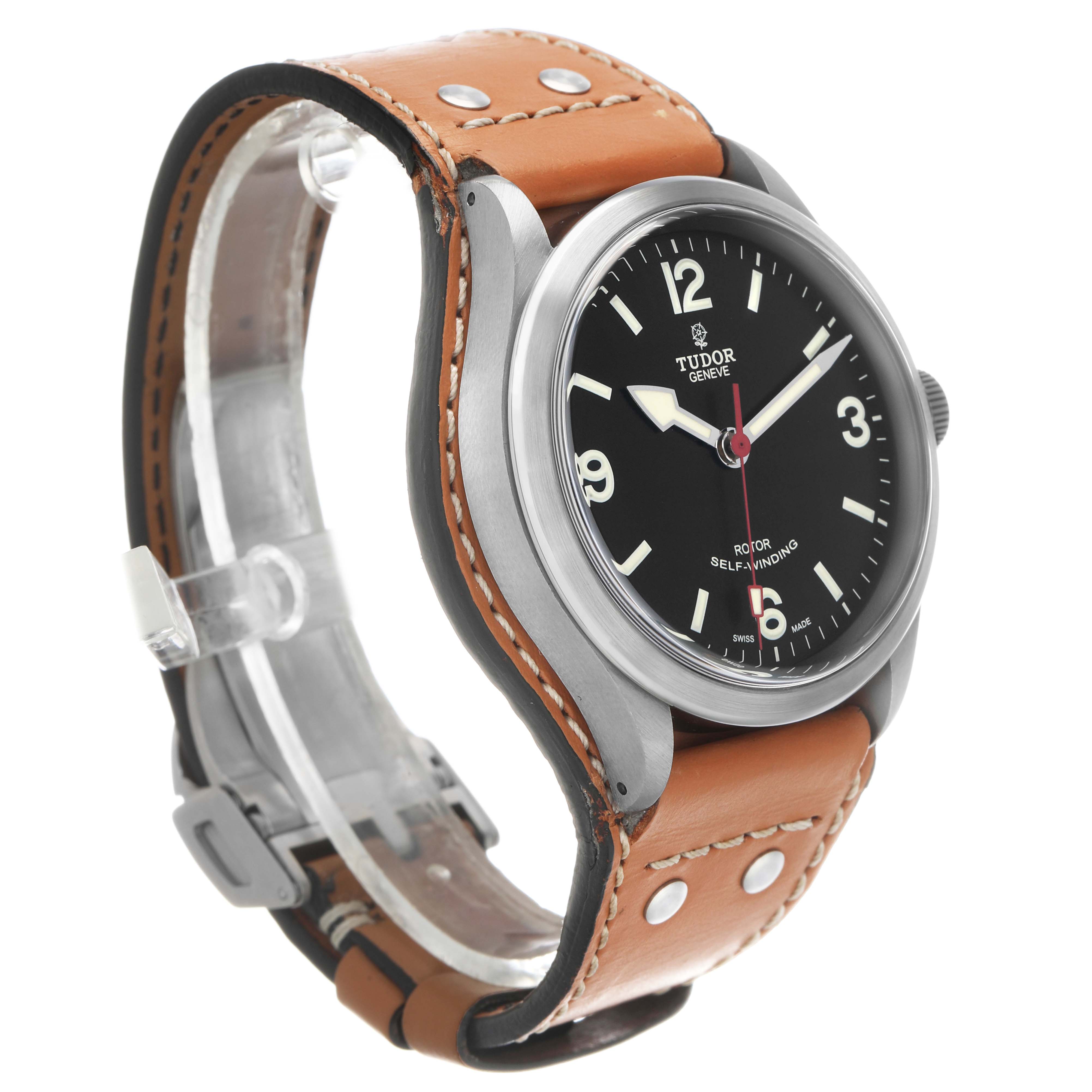 The Tudor Heritage Ranger M79910-0002 Men's Stainless Steel Black Dial watch is shown at a three-quarter angle, highlighting the dial, case, crown, and leather strap.