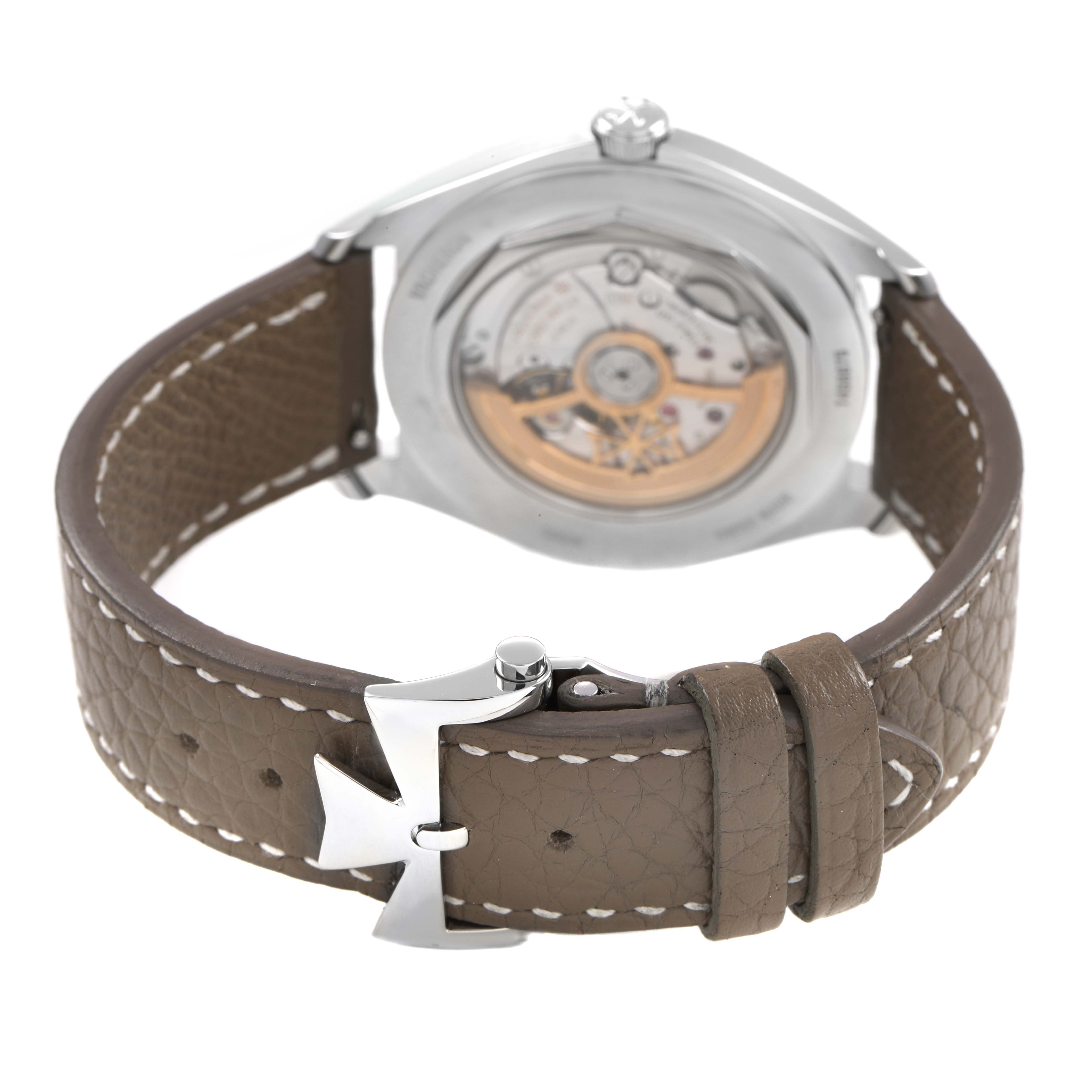 The Vacheron Constantin Fiftysix 4600E Men's Stainless Steel Silver Dial watch is shown from the back, highlighting the movement and leather strap with a branded buckle.
