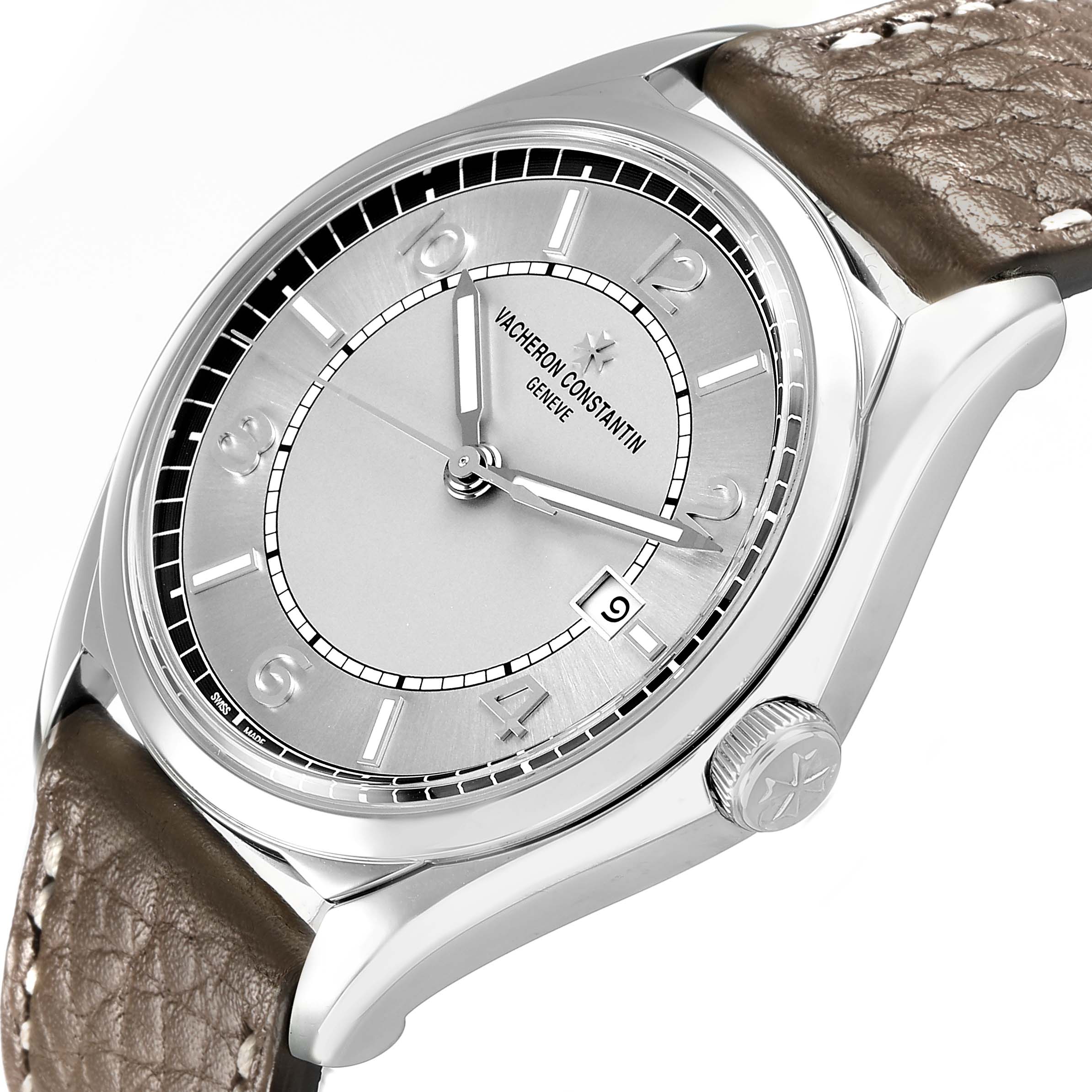 The Vacheron Constantin Fiftysix 4600E Men's Stainless Steel Silver Dial watch is shown at a tilted angle, featuring its face, crown, and leather strap.