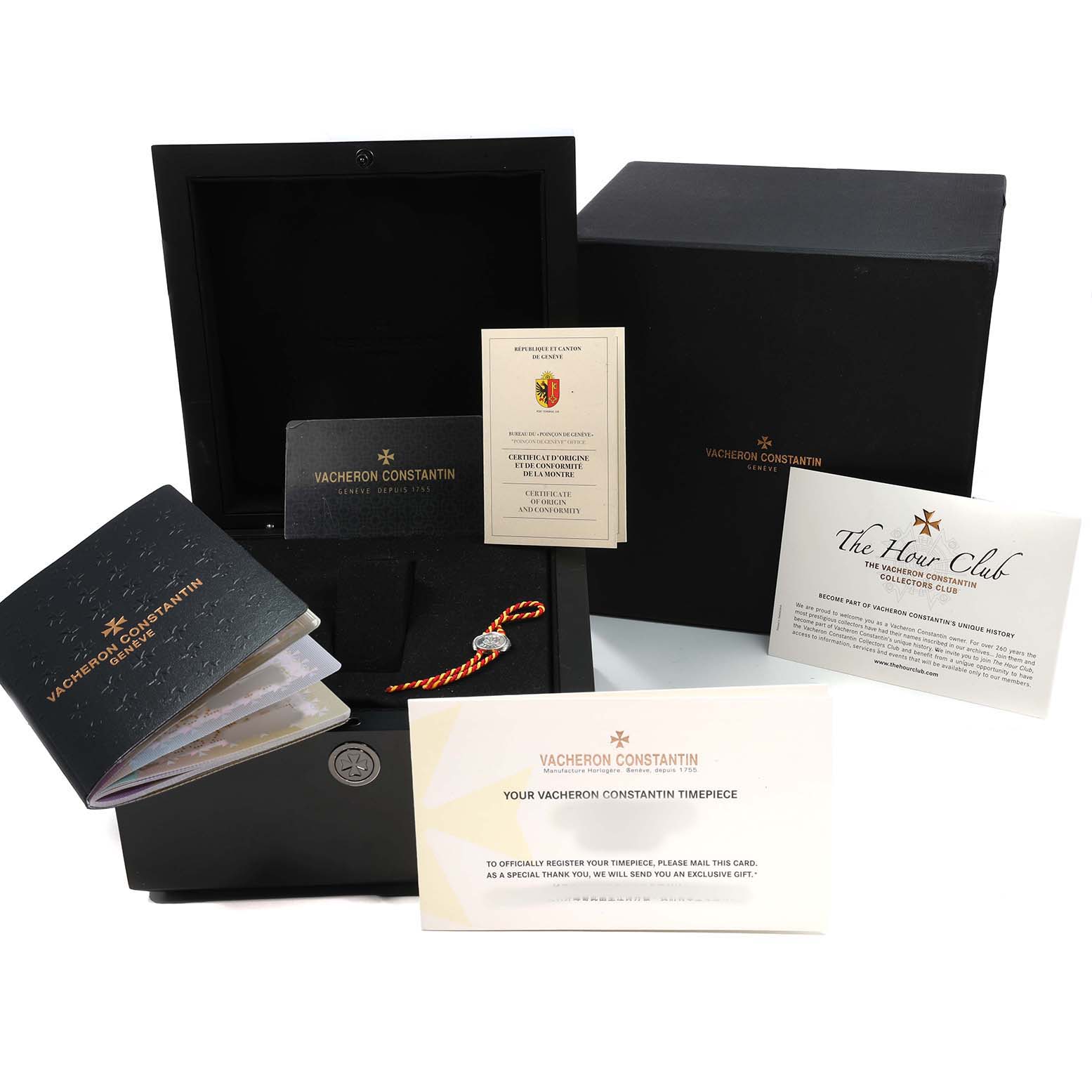 The image shows packaging and accessories for the Vacheron Constantin Overseas 7900V Men's Stainless Steel Silver Dial model, including a box, booklet, and cards.