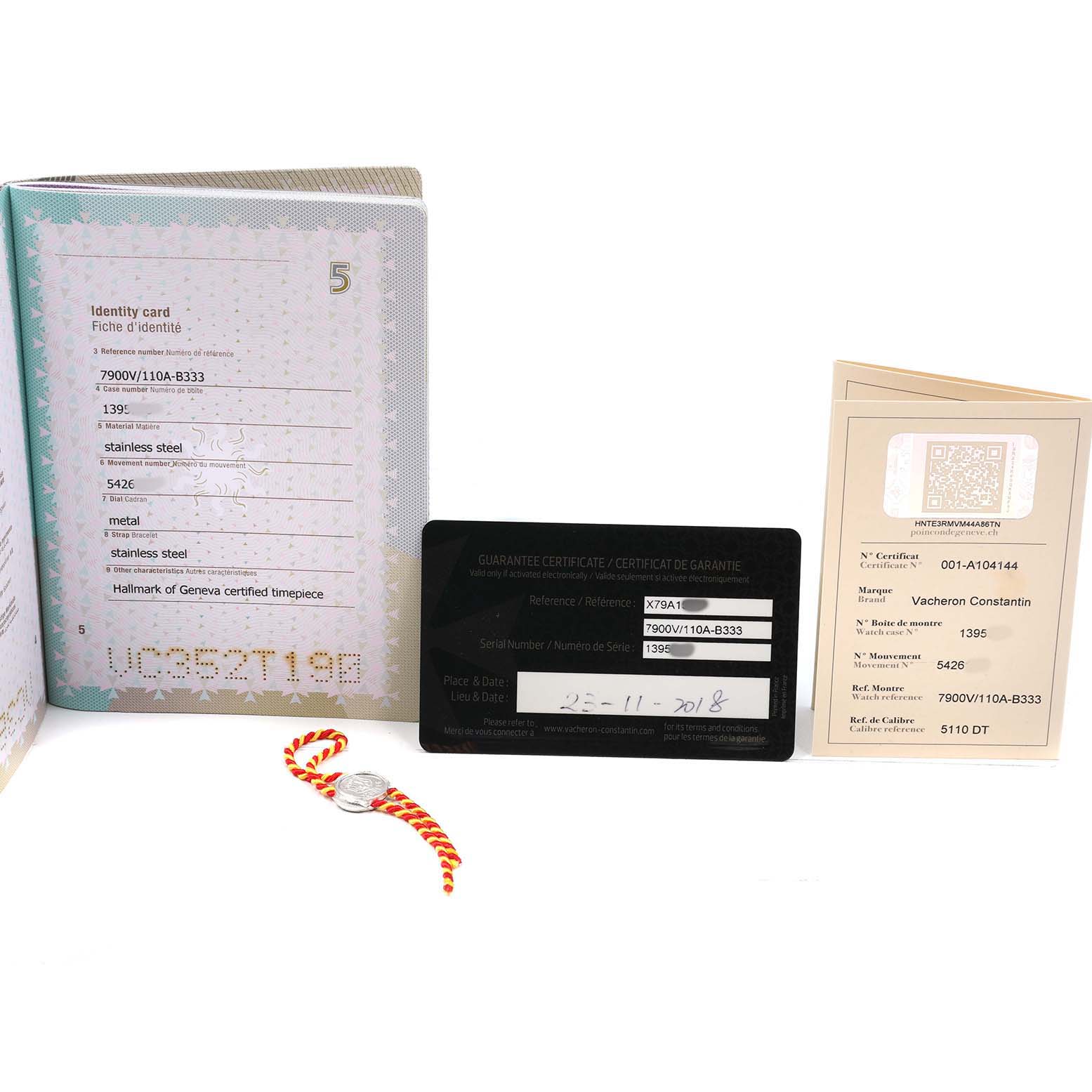 The image shows the documentation and accessories for the Vacheron Constantin Overseas 7900V Men's Stainless Steel Silver Dial model, including certificates and a tag.