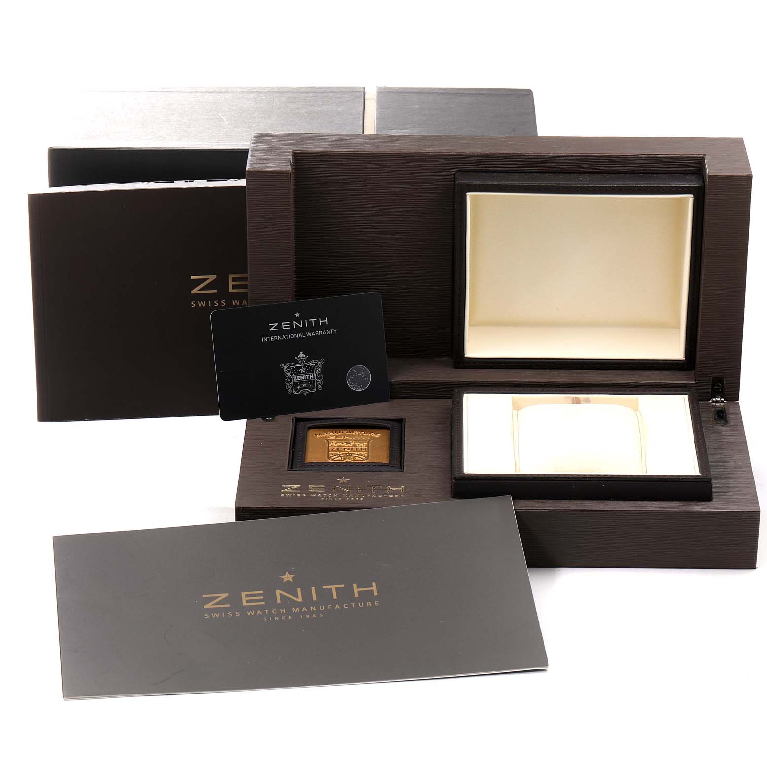 The image shows the packaging and accessories of the Zenith Chronomaster 03.2080.4021/21.C496 Men's Stainless Steel Black Dial 03.2080.4021/21.C496 Men's Stainless Steel Black Dial watch, including the box, warranty card, and booklets.