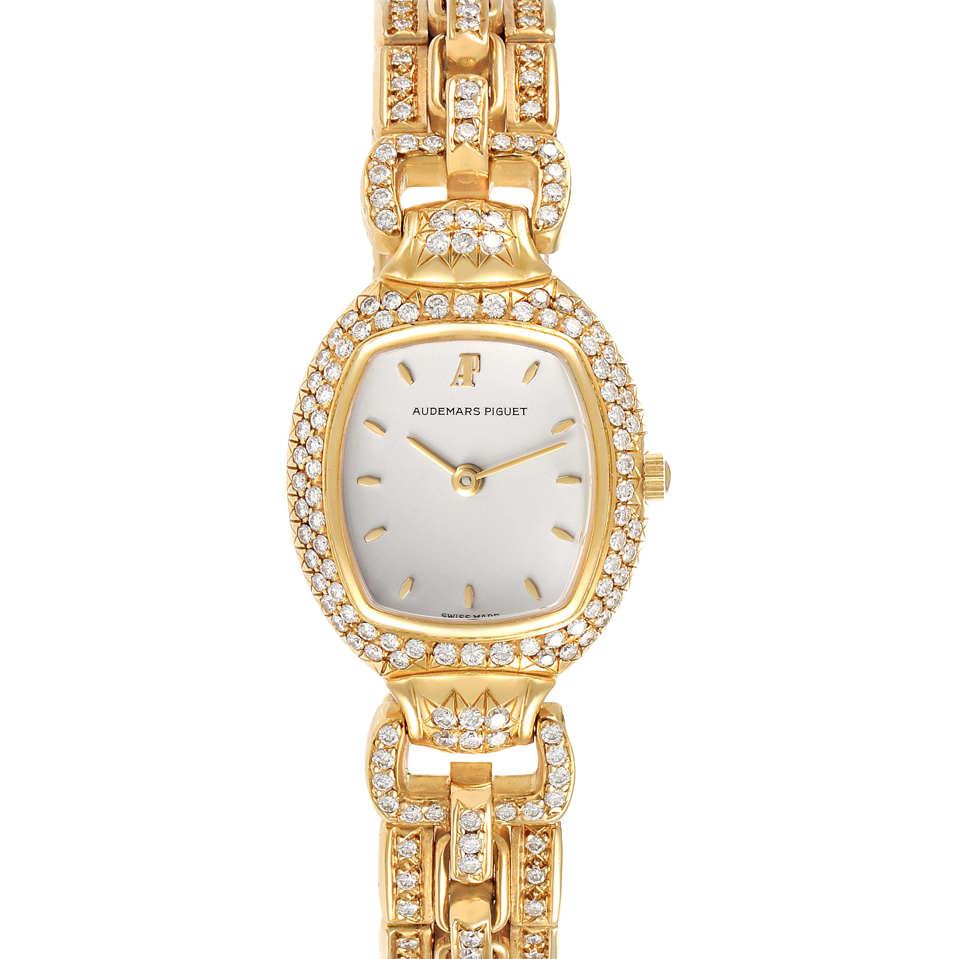 This image shows a front view of a Vintage Audemars Piguet watch, highlighting its diamond-studded bezel and gold bracelet.