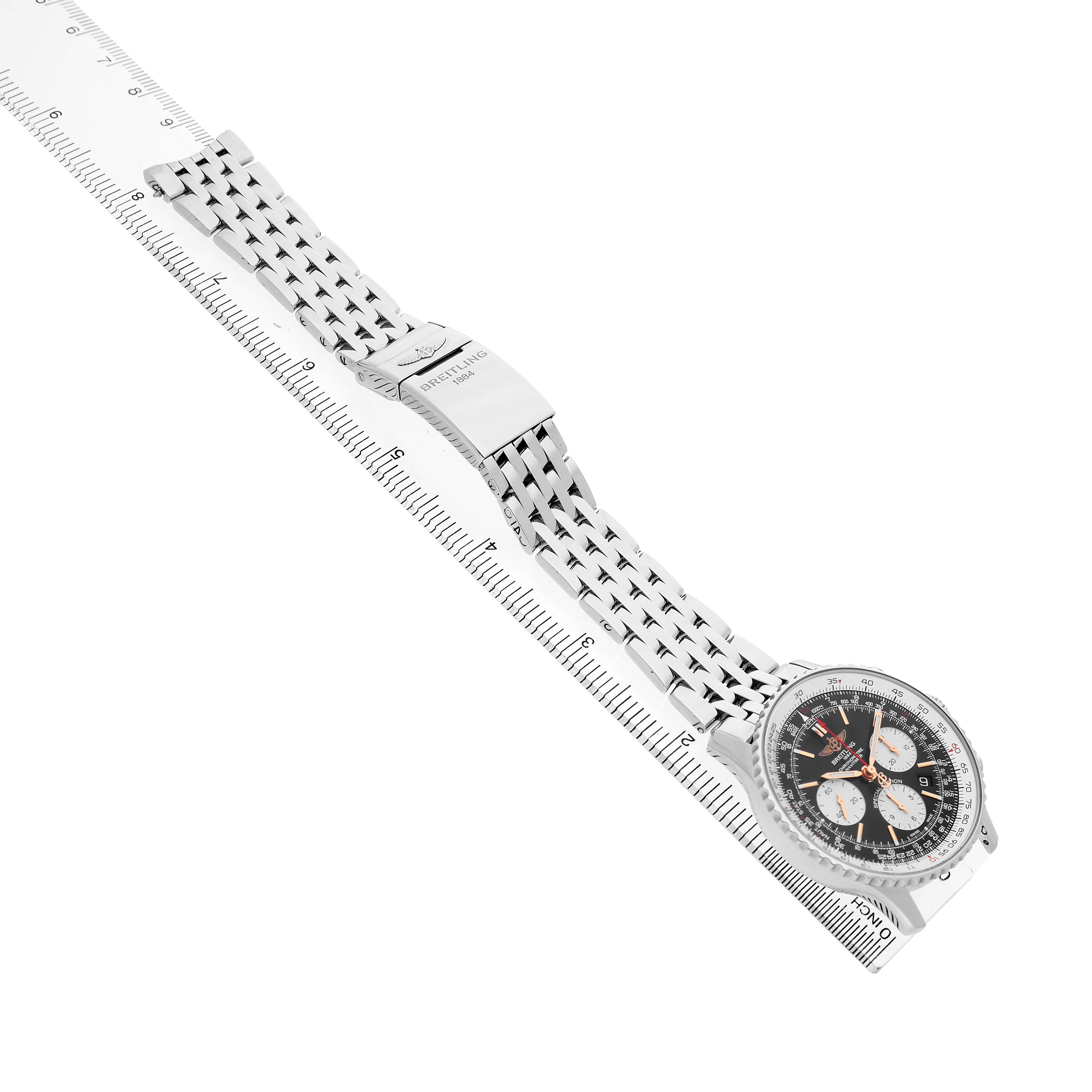 The Breitling Navitimer AB0121 Men's Stainless Steel Black Dial watch is shown from an angled side view, displaying its face and metal bracelet.