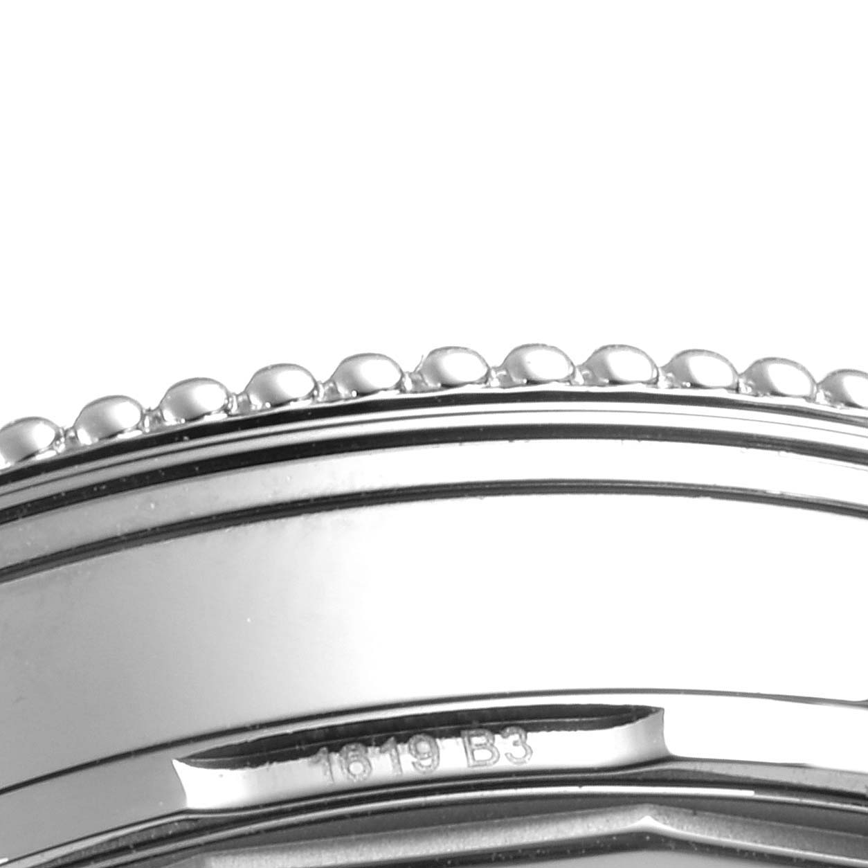 The image shows a close-up of the bezel and edge of the case for a Breitling Navitimer A17325 Men's Stainless Steel Blue Dial A17325 Men's Stainless Steel Blue Dial watch.