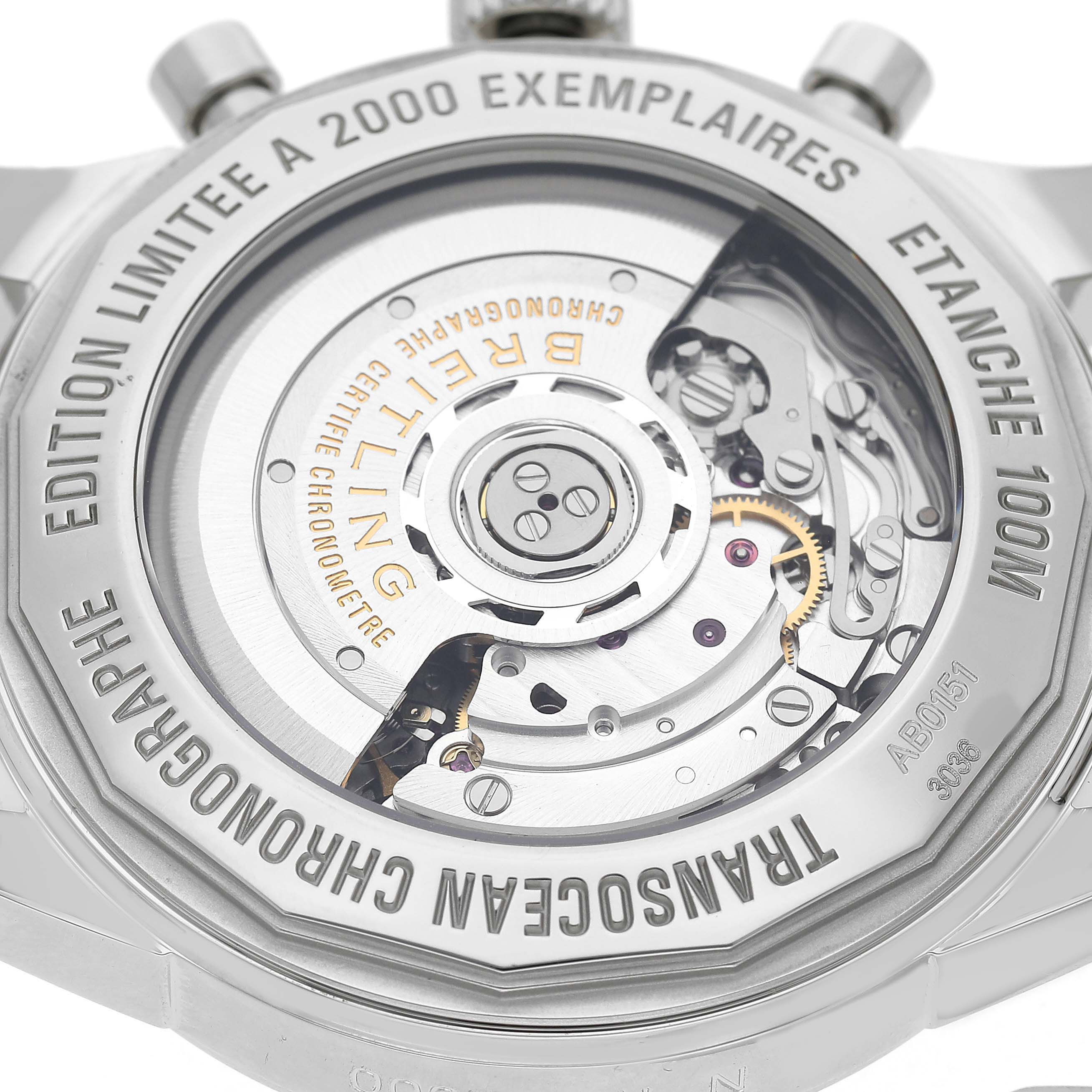 The image shows the back of a Breitling Transocean AB0151 Men's Stainless Steel Black Dial watch, highlighting its movement and limited edition engraving.