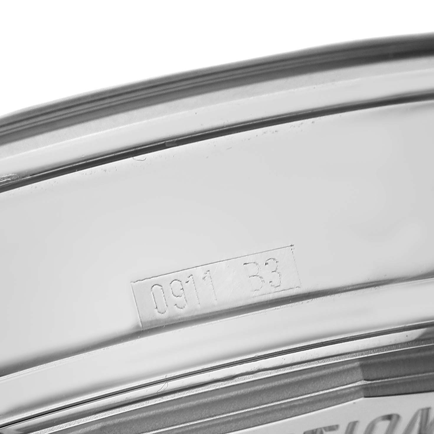 The image shows a close-up of the case edge with engravings on the Breitling Transocean AB0151 Men's Stainless Steel Black Dial watch.