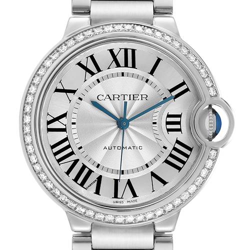 The image shows the Cartier Ballon Bleu W4BB0017 Men's Stainless Steel Silver Dial watch face-on, highlighting its round dial, Roman numerals, and signature crown with a blue cabochon.