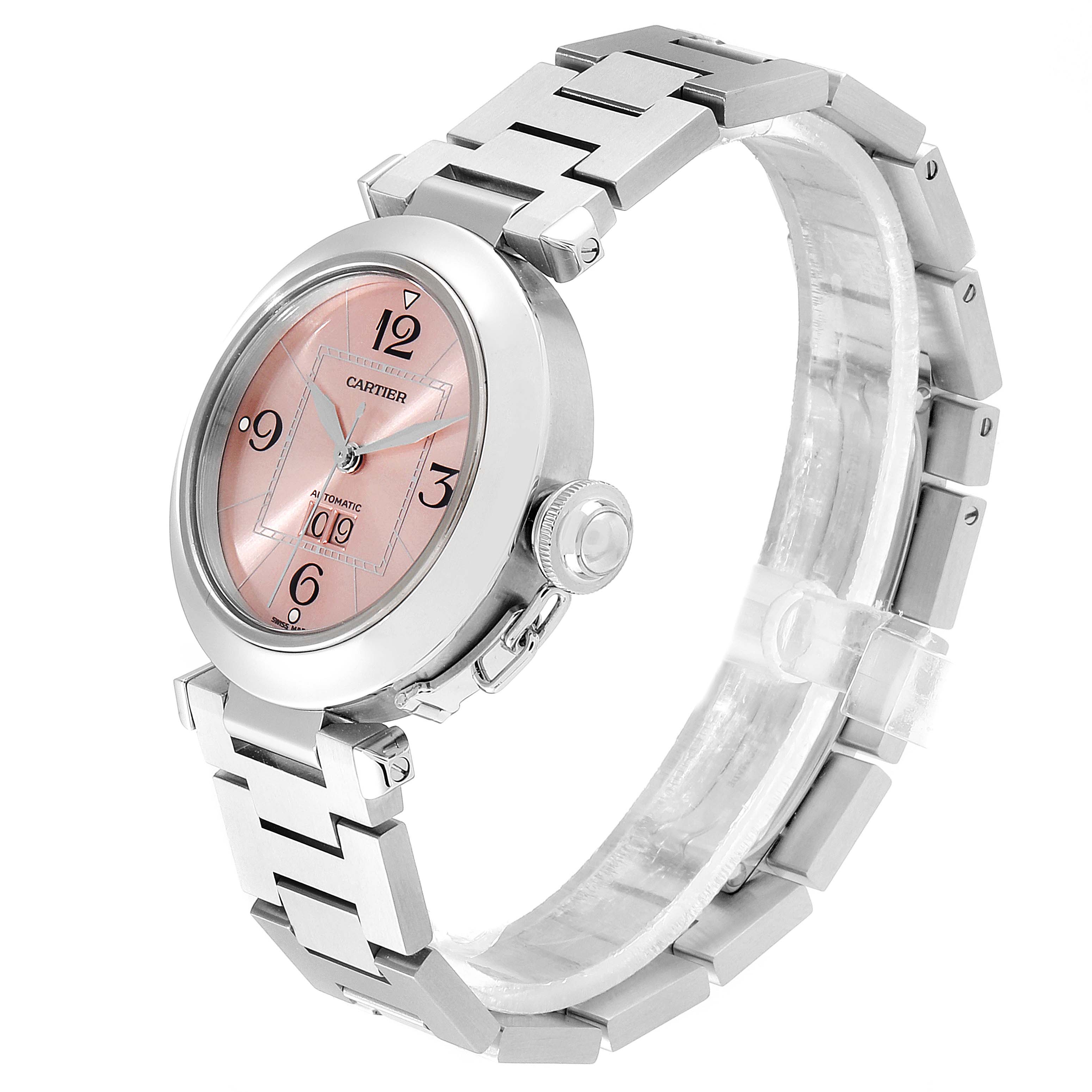 The Cartier Pasha W31058M7 Women
s Stainless Steel Pink Dial W31058M7 Women
s Stainless Steel Pink Dial watch is shown at a side angle, displaying its pink dial, crown, and metal bracelet.