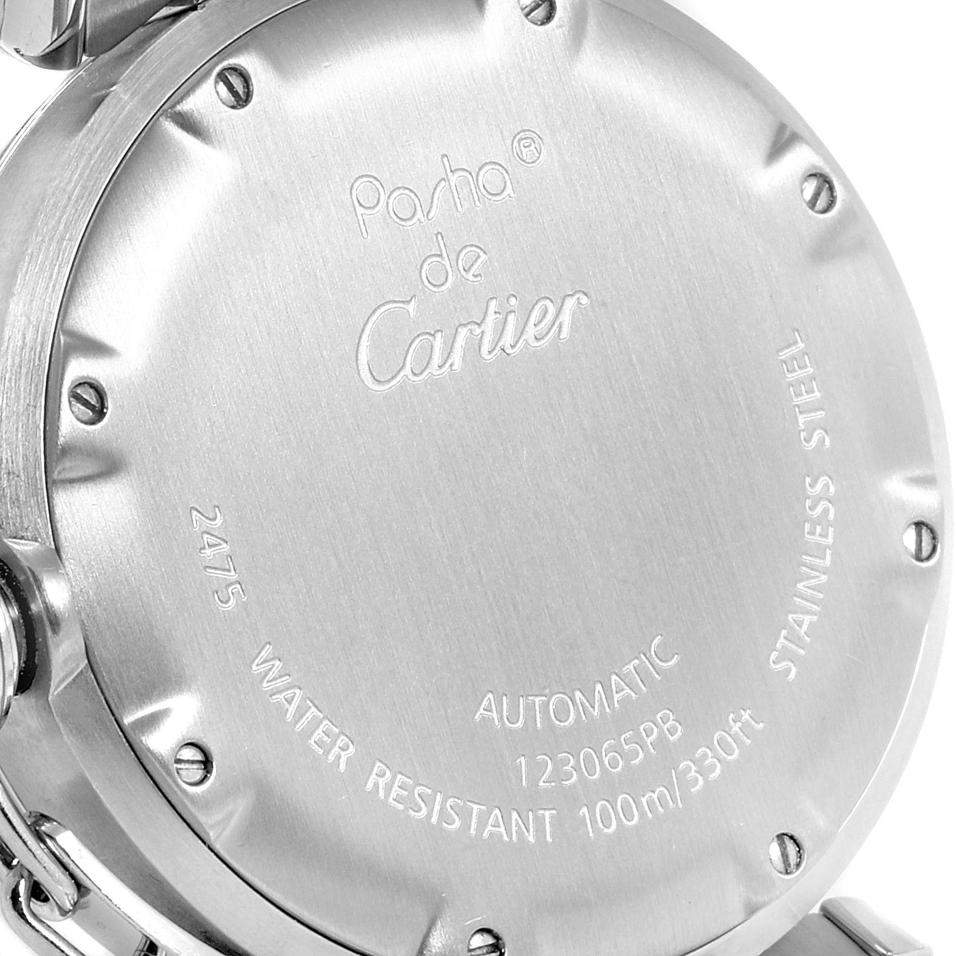The image shows the back casing of the Pasha de Cartier watch, highlighting its stainless steel material and water resistance.
