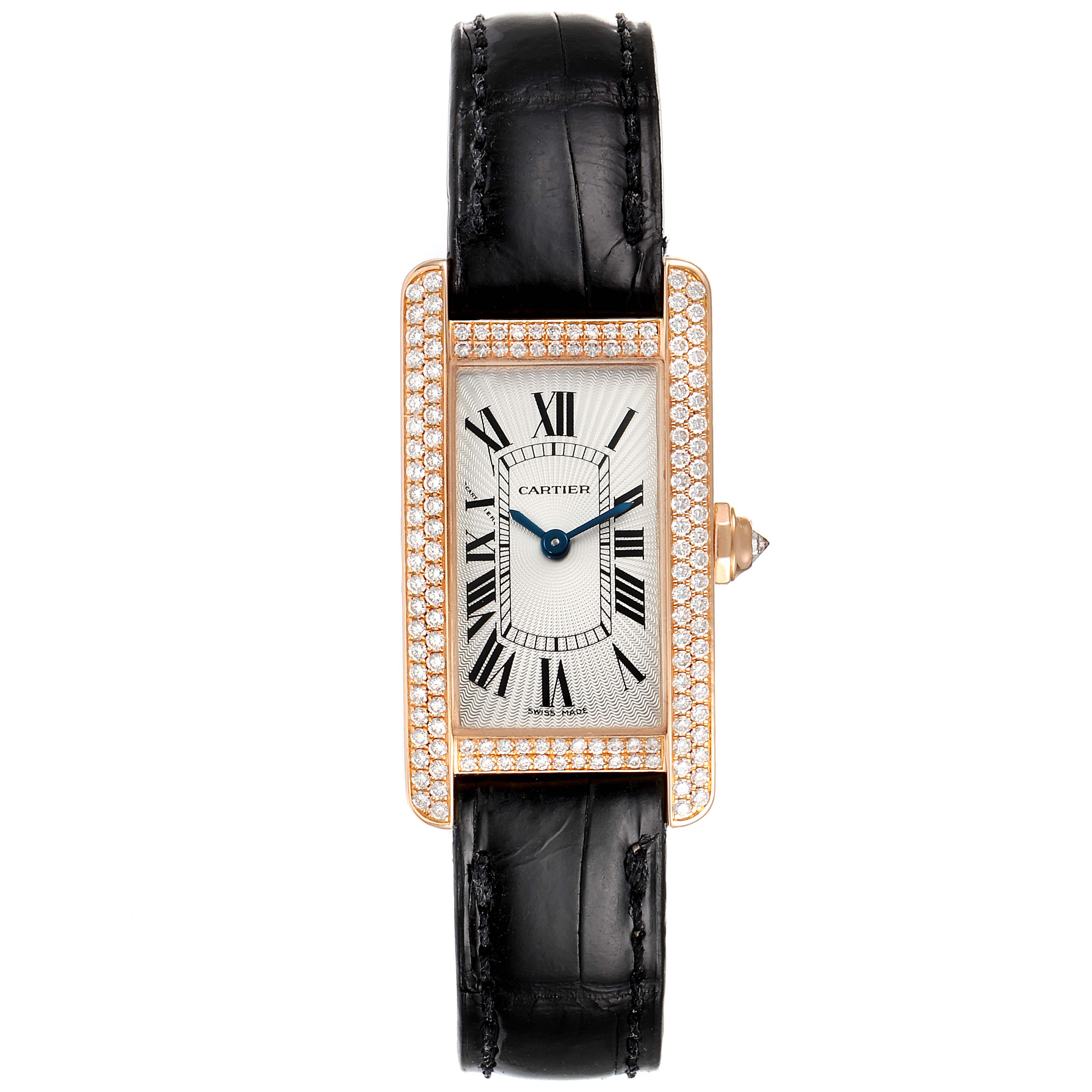 The image shows a front view of the Cartier Tank Americaine WJTA0002 Women
s Rose Gold Silver Dial WJTA0002 Women
s Rose Gold Silver Dial watch with a black leather strap and a diamond-encrusted gold case.