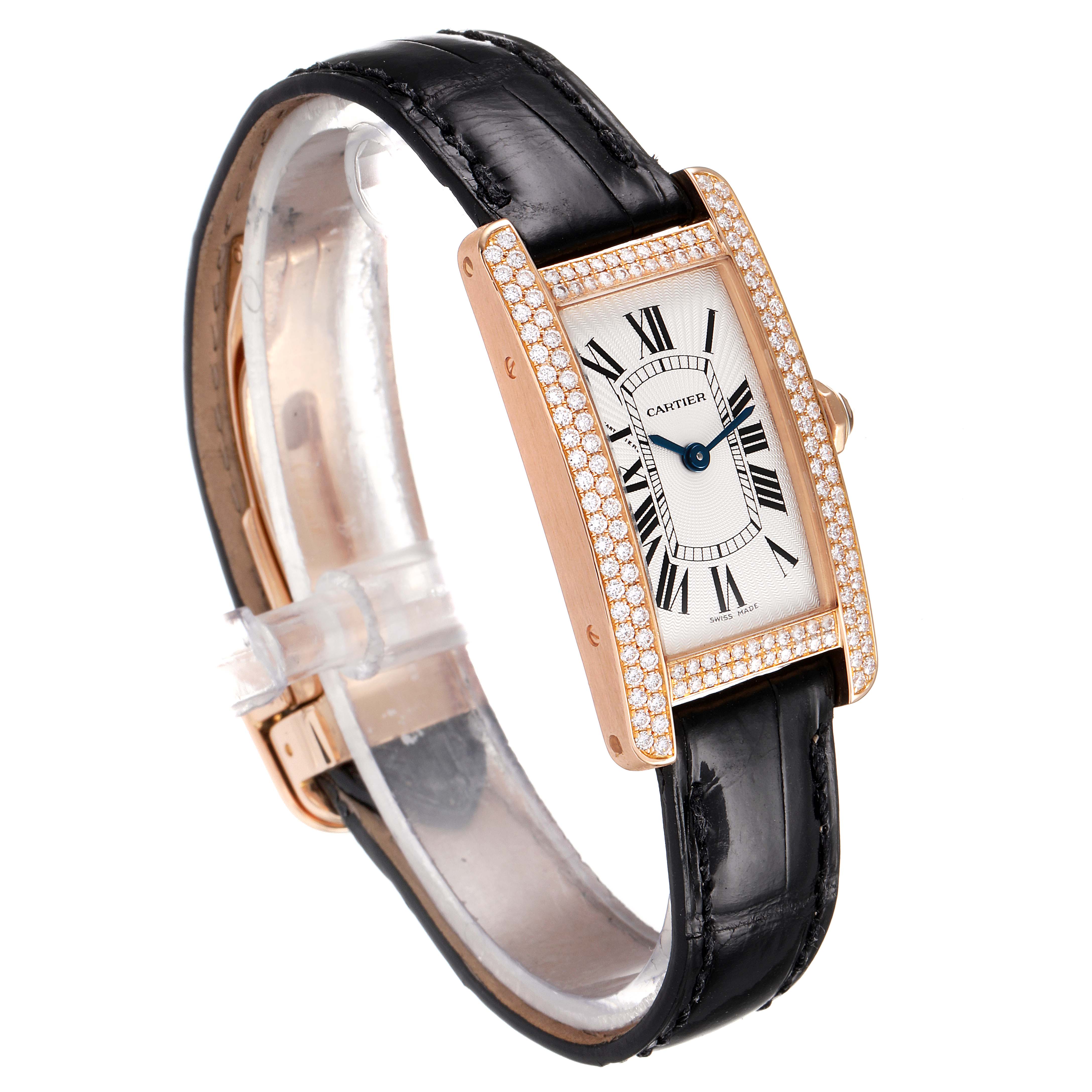 The image shows the Cartier Tank Americaine WJTA0002 Women
s Rose Gold Silver Dial WJTA0002 Women
s Rose Gold Silver Dial watch at a side angle, displaying its face, bezel, strap, and clasp.