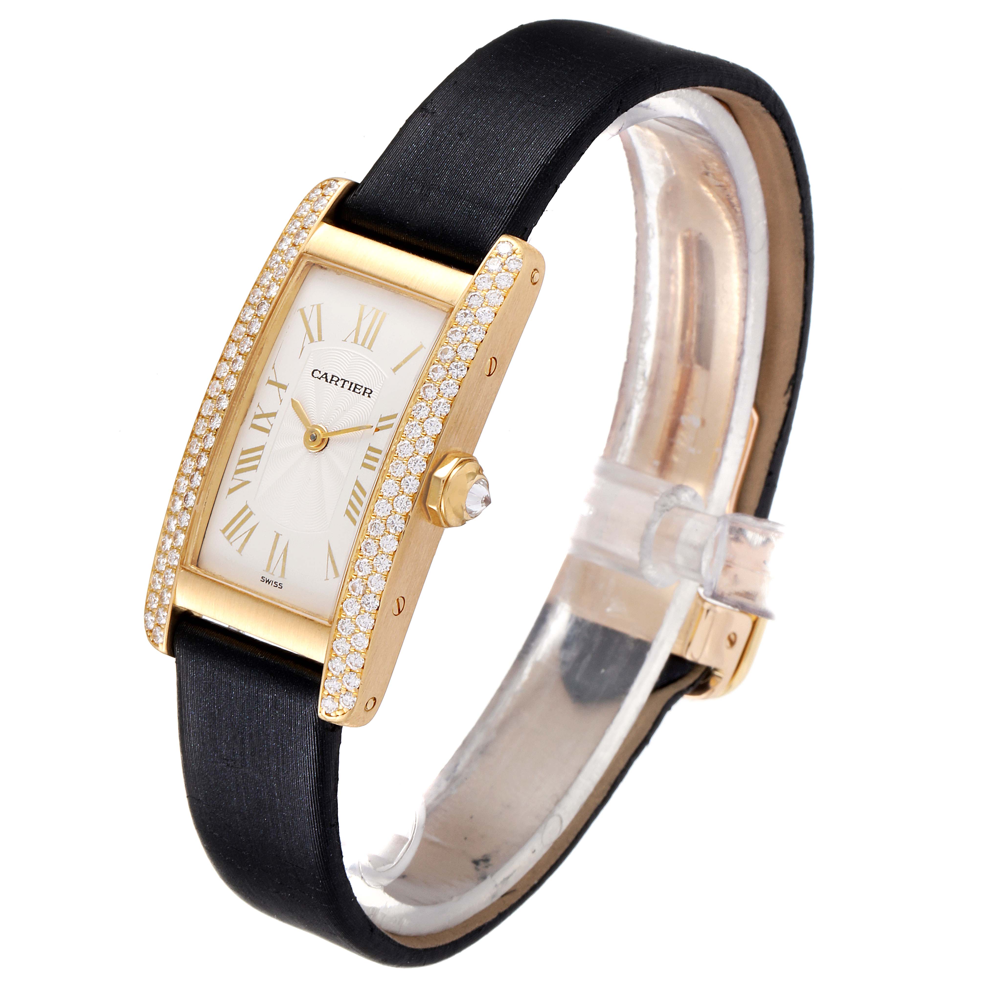 The Cartier Tank Americaine 1710 Women
s Yellow Gold Silver Dial 1710 Women
s Yellow Gold Silver Dial model is shown from a three-quarter angle, revealing the strap, dial, and diamond-studded case.