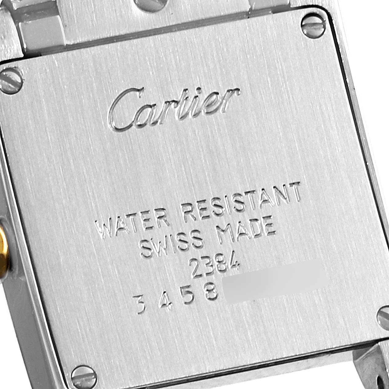 The image shows the back case of a Cartier Tank Française watch, featuring the brand name and model details.