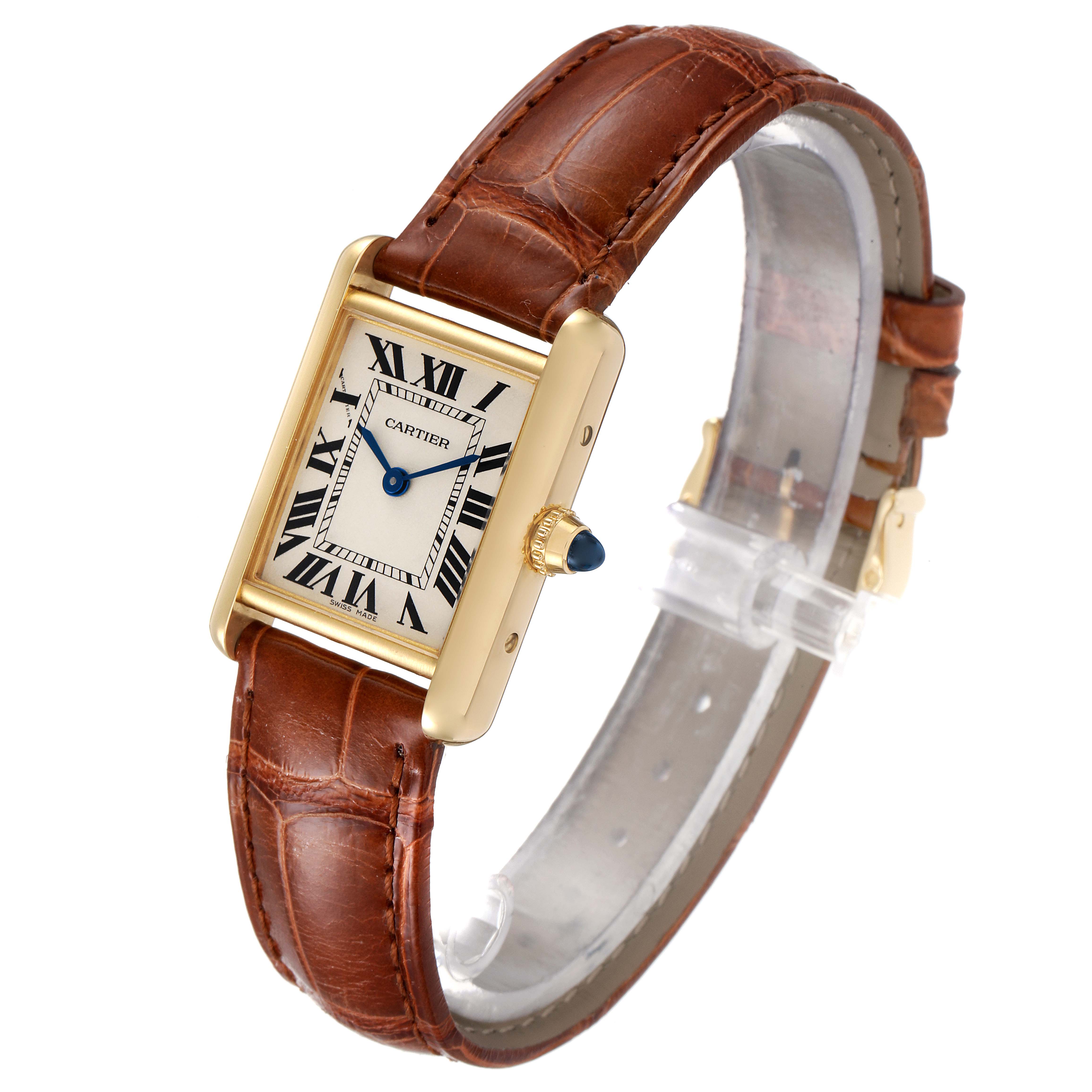 The image shows a tilted view of the Cartier Tank Louis W1529856 Women's Yellow Gold Silver Dial W1529856 Women's Yellow Gold Silver Dial watch, highlighting its rectangular face, gold case, and brown leather strap.